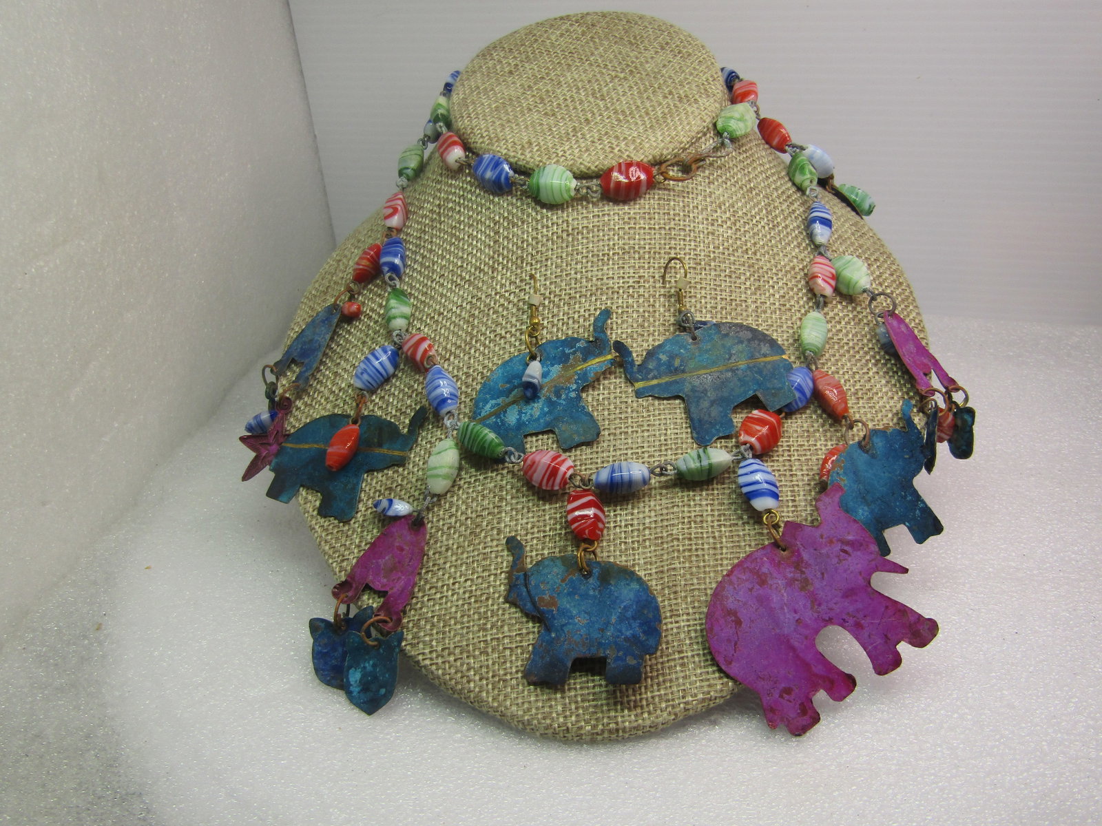 Vintage Glass Beaded Elephant & Cat Dangle Necklace Earrings Set , 28", 1970's-1980's: Vintage Glass Beaded Elephant & Cat Dangle Necklace and Earrings Set, Pierced. , 28", 1970's-1980's. This appears to be painted copper cut in elephant shapes as well as cat body and head shapes - odd 