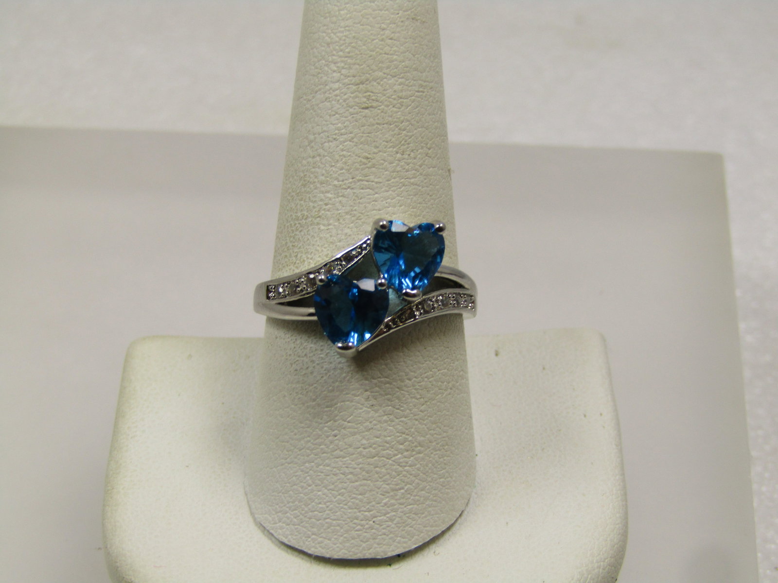 Blue Heart & Clear Stone Bypass Ring, Sz. 9.5, Silver Tone, 2000's: Blue Heart & Clear Stone Bypass Ring, Sz. 9.5, Silver Tone, 2000's. Two hearts (appx. 6mm wide each) that are set in a bypass type design with the band being split on top and one heart set over the ot