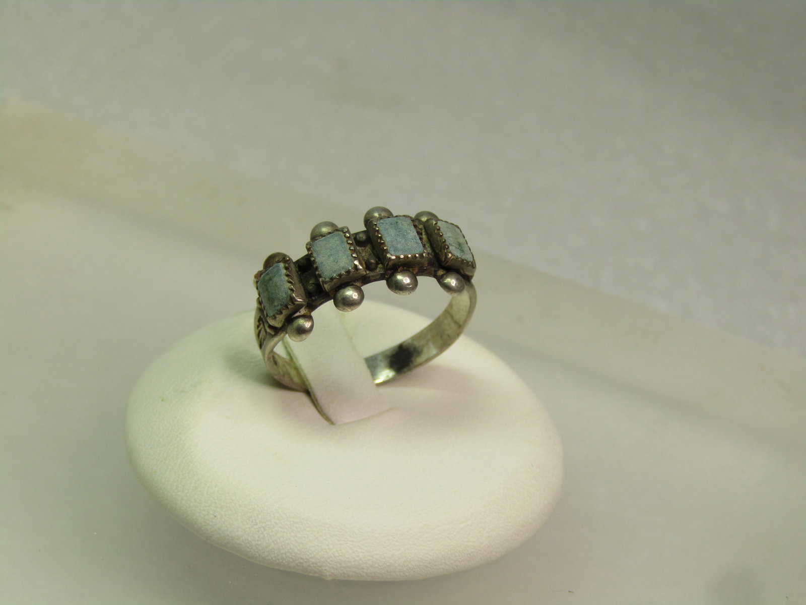 Vintage Sterling Southwestern Green Stone Ring, Sz. 8, 1960's-1970's: Vintage Sterling Southwestern Green Stone Ring, Sz. 8, 1960's-1970's. The stones are believed to be chrysoprase. The ring is appx. 9.5mm wide on top. There are four, sawtooth bezel-set stones with a b