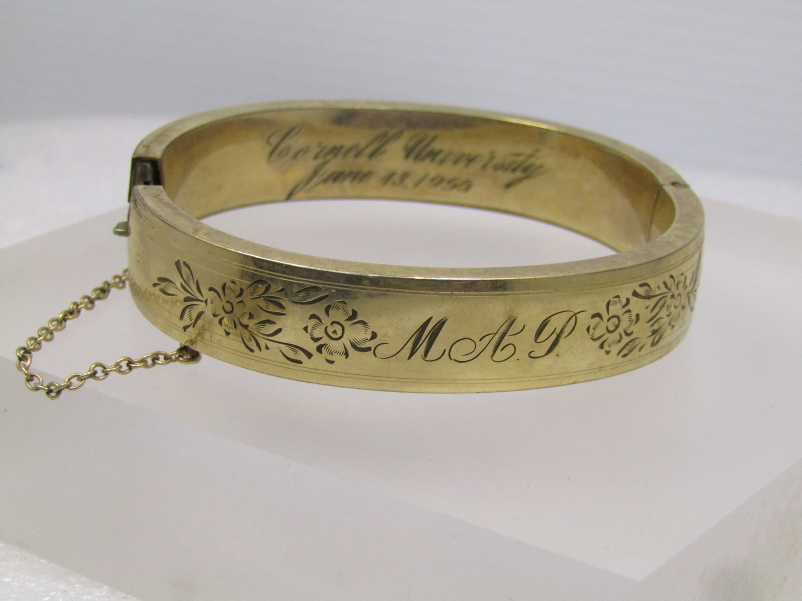 Vintage 12kt G.F. Hinged Engraved Bangle Bracelet, 1950's, Signed: Vintage 12kt G.F. Hinged Engraved Bangle Bracelet, 1950's, Signed with a star maker's mark. It is appx. 1/2" wide with engraved initials M.A.P and leaves on the front and an outline on each edge aroun
