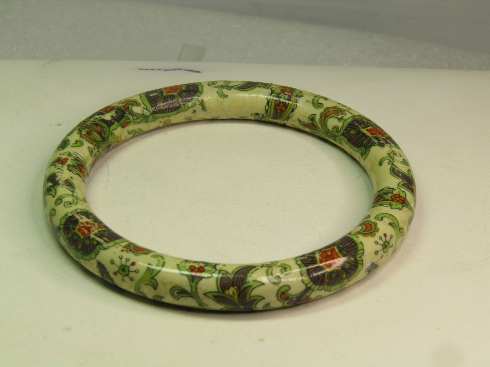 Vintage Floral Transfer Bangle Bracelet, 8", 1960's-1980's: Vintage Floral Transfer Bangle Bracelet, 8", 1960's-1980's. This is a heavy 9.5mm rounded bangle bracelet that has a 1960's style floral transfer design on it. it may be bone - it is heavy - not like 