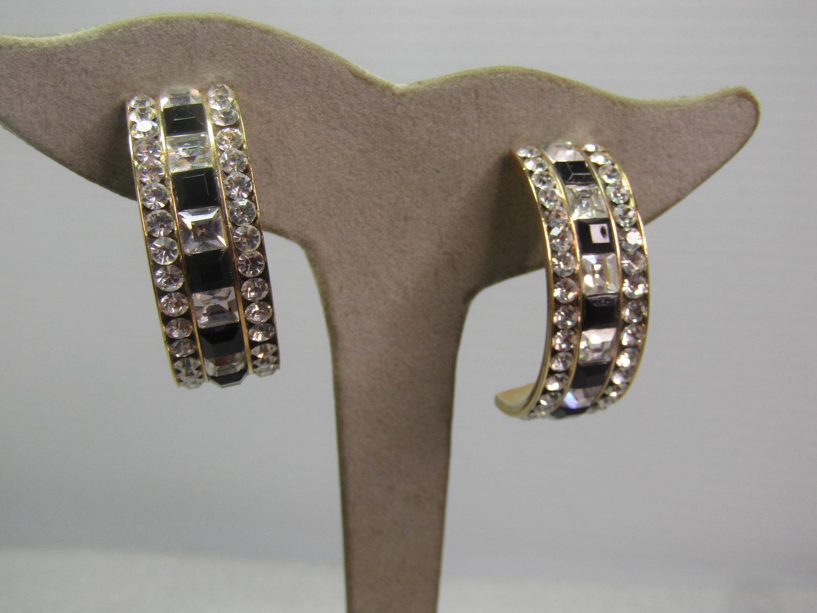 Vintage Black & Clear Rhinestone Half-Hoop Earrings, Pierced, 1980's-1990's: Vintage Black & Clear Rhinestone Half-Hoop Earrings, Pierced, 1980's-1990's. The rhinestones are glass and square down the center alternating between black and clear and clear round stones on the edge