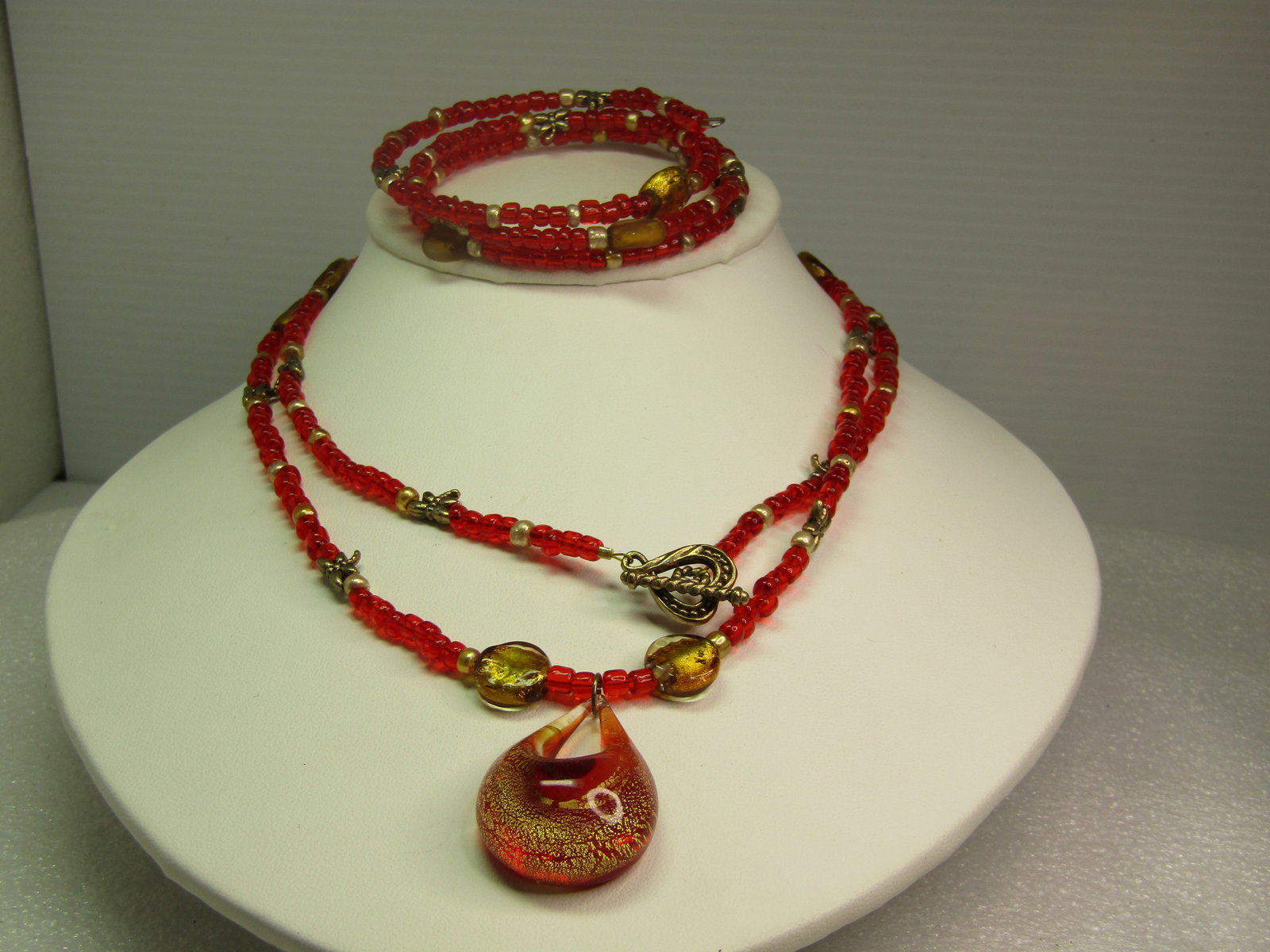 Vintage Red Glass Drop Necklace & Coiled Bracelet Set, 1980's-1990's: Vintage Red Glass Drop Necklace & Coiled Bracelet Set, 1980's-1990's. This has red/orange glass seed beads that are appx. 3.5mm with glass gold seed bead spacers into be the red sections and larged fo