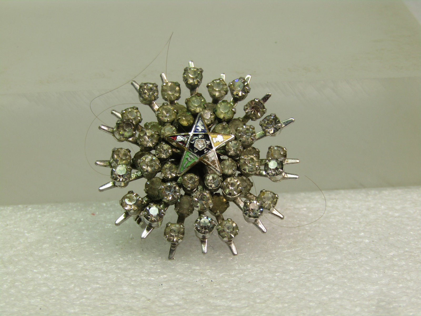 Vintage Rhinestone Eastern Star Brooch, 1950's-1960's: Vintage Rhinestone Eastern Star Brooch, 1950's-1960's. This has the Eastern Star enameled star in the center with rays of rhinestones reaching outward like a starburst in several tiers. This is appx. 