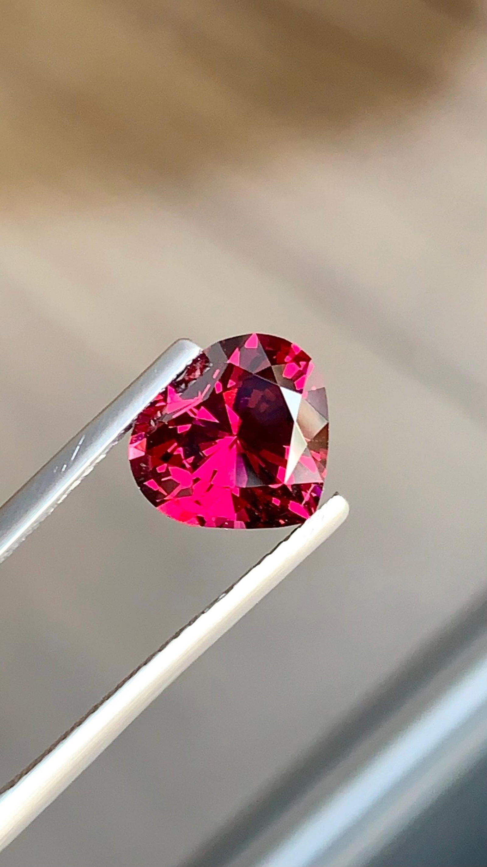 Tanzania Pinkish Red Garnet Gemstone: Heart Cut, 3.365 Carat: Highlights Supplies for making crafts Materials: Gemstone: Garnet Carat weight: 3.36 * Weight : 3.36 carat * Dimension : 9.6 x 8.8 x 6 MM * Shape : Heart Cut * Color : Pinkish Red * Clarity : Eye