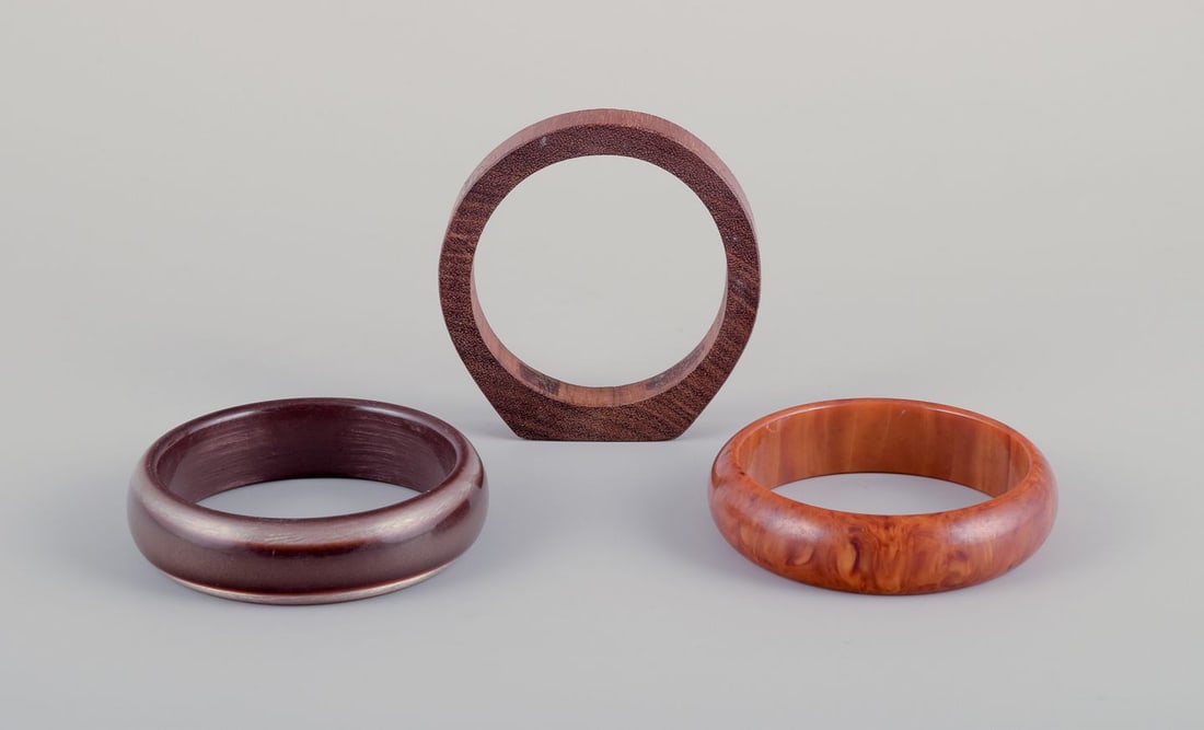 French jewelry designer. Three bracelets. Two in plastic and one in wood. Late 20th C.: Title:French jewelry designer. Three bracelets. Two in plastic and one in wood. Late 20th C. Brand:SILVER & JEWELRY Description:French jewelry designer. Three bracelets. Two in plastic and one in wood