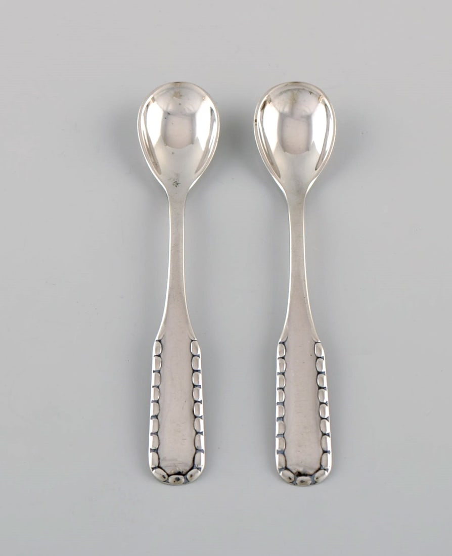 Two early Georg Jensen Rope salt spoons in silver (830). Dated 1909-1914. - 2