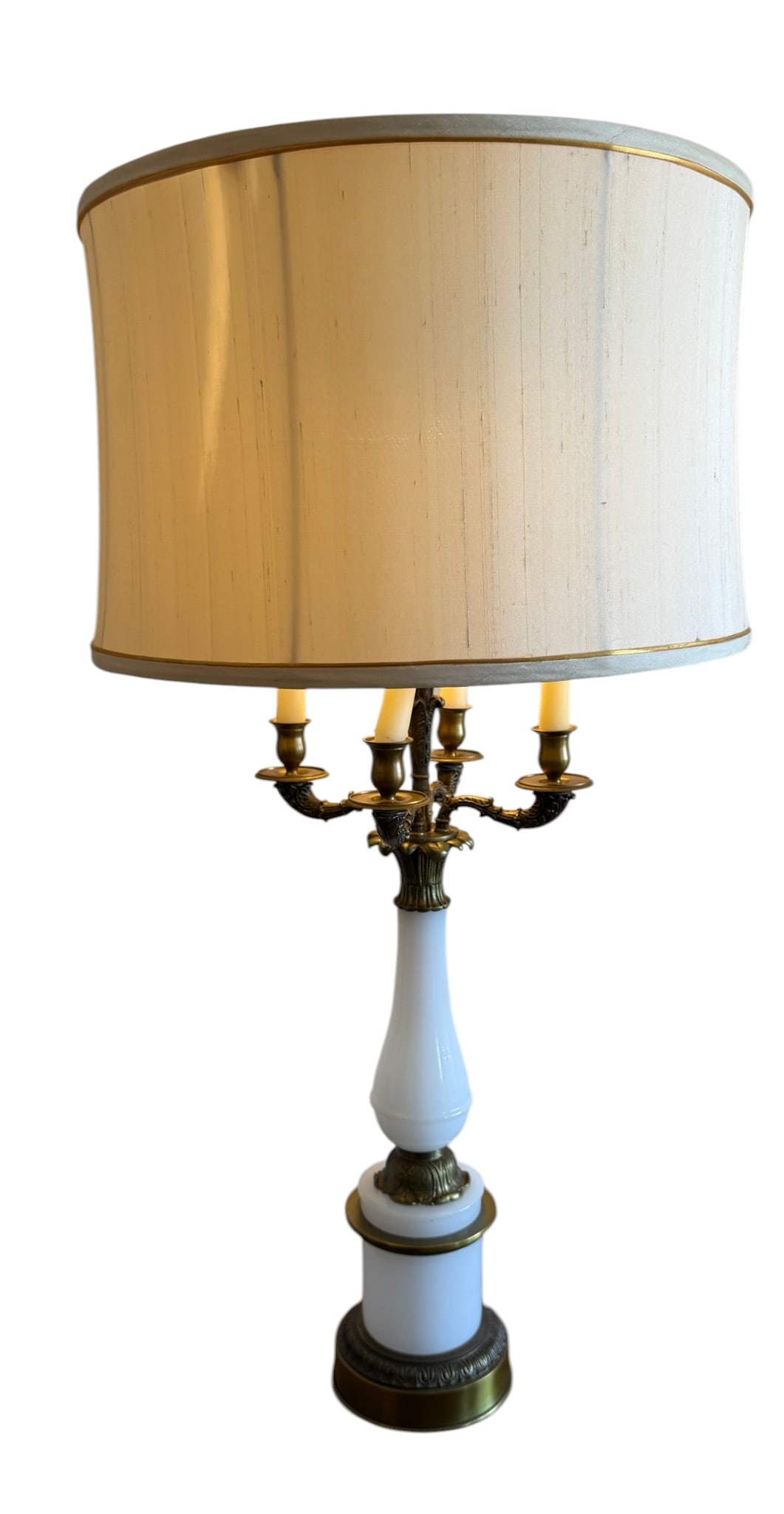 Set of Two Vintage Hollywood Regency Style Opaque White Glass & Gilt Bronze Bouillotte Table Lamp: These elegant table lamps, crafted in the Hollywood Regency style, feature an opaque white glass body accented with ornate gilt bronze mounts. These lamps are designed in the bouillotte style, with
