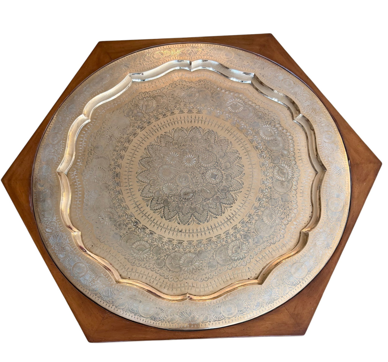 Moroccan-Style Brass Tray-Top Occasional Table: An attractive Moroccan-style occasional table, featuring a large, ornate brass tray set into a hexagonal wooden base. The brass tray is intricately engraved with a central medallion and repeating flor