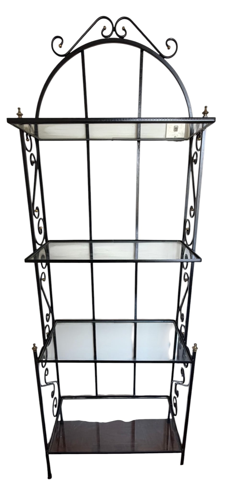 Wrought Iron and Glass Étagère: A contemporary wrought iron and glass étagère. This shelving unit features a black wrought iron frame with an arched top and decorative scrolling accents. It is fitted with four clear glass 