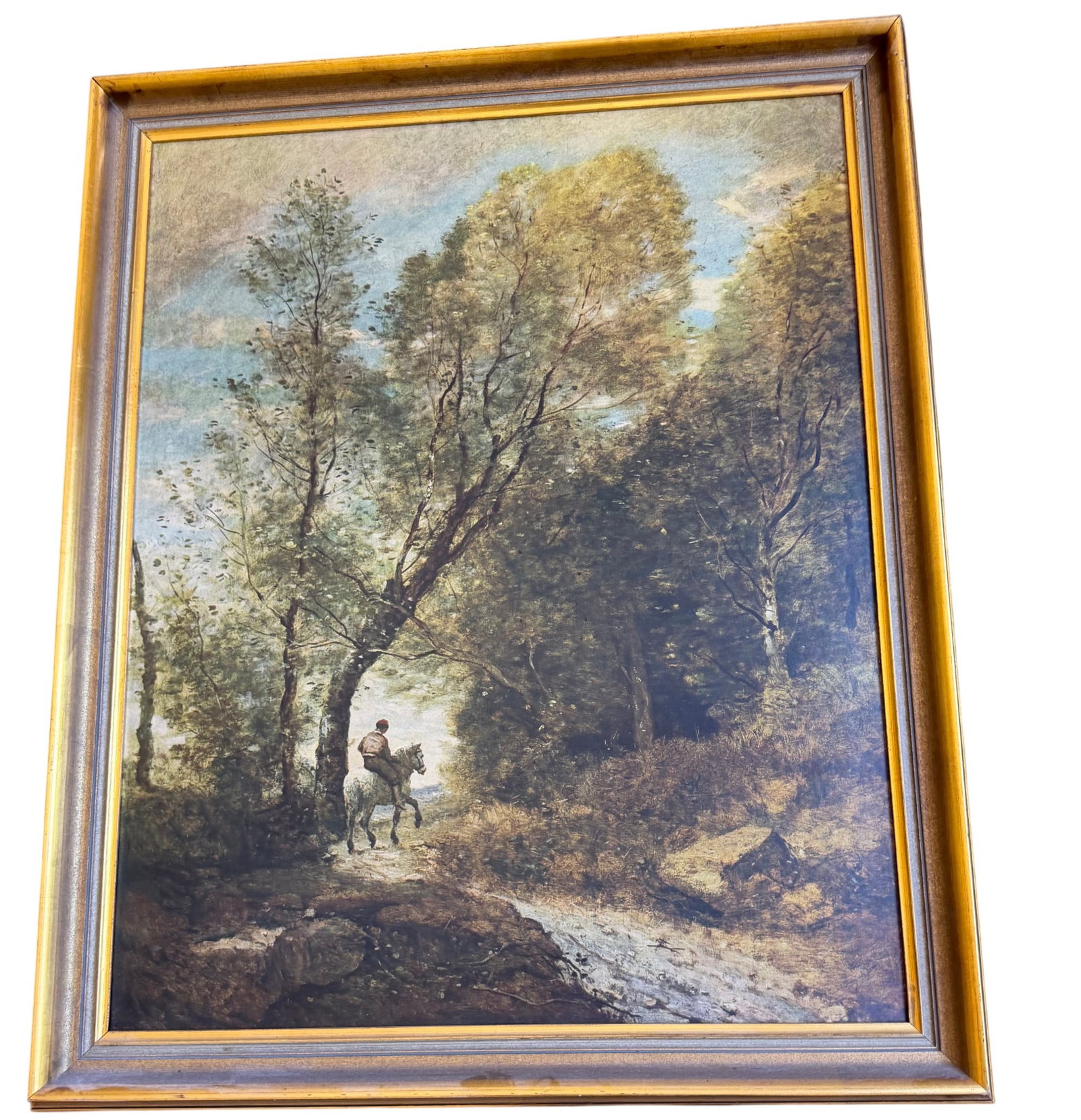 Framed Romantic Landscape Oil Painting on Canvas: This framed oil painting on canvas depicts a romantic landscape scene with a lone rider on horseback traversing a wooded path. The impasto technique is visible in the brushstrokes, particularly in