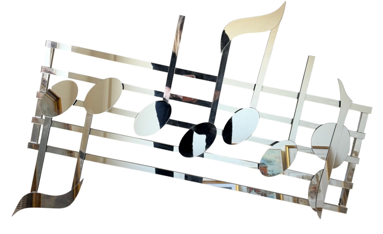 Musical Notes Mirrored Wall Sculpture: A striking Hollywood Regency-style wall sculpture from the late 20th century, depicting a series of musical notes on a staff from Imagine by the Beatles. The work is crafted from mirrored panels,