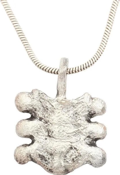EUROPEAN NOBLE WOMAN'S NECKLACE PENDANT: Title: EUROPEAN NOBLE WOMAN'S NECKLACE PENDANT Description: C.100 AD. Over 3/4" height, silvered bronze as a symmetrical plume splay. Well detailed and excellent. The pendant of a noblewoman incorpora