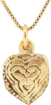 FINE VIKING HEART PENDANT, 10TH - 11TH CENT. AD: Title: FINE VIKING HEART PENDANT, 10TH - 11TH CENT. AD Description: Just under 1/2" width. Broad heart of cusped form and domed section. The back hollow, perhaps for a keepsake. The central stylized t