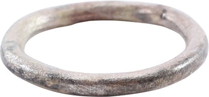 VIKING BEARD RING, 9TH-11TH CENTURY: Title: VIKING BEARD RING, 9TH-11TH CENTURY Description: Round, one side is flat and the other rounded. 0.50” inside diameter and 0.61" outside. The use of beard rings by Vikings is well document