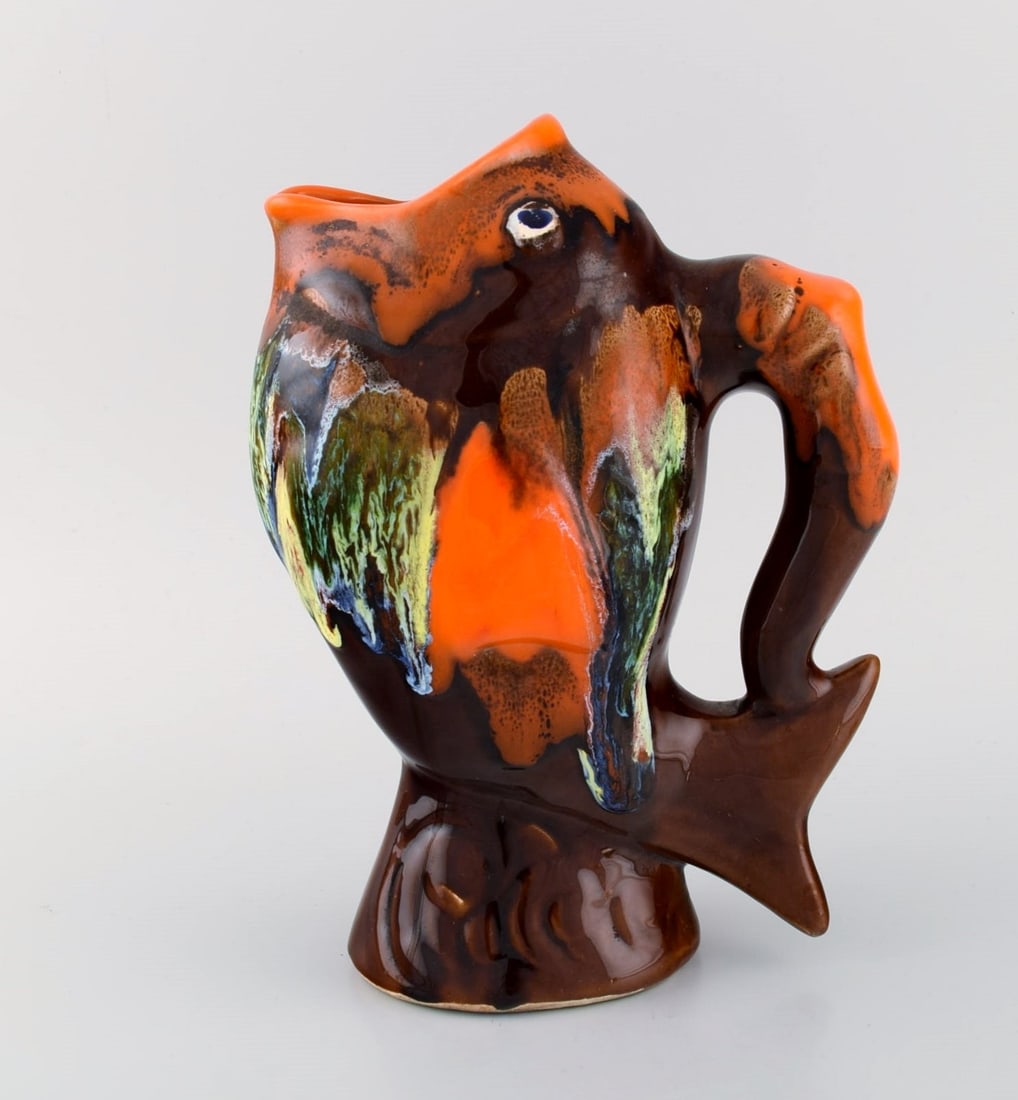 Belgian studio ceramicist. Retro jug in glazed ceramisc shaped like a fish. Beautiful glaze in brown: Brand: Various Belgian studio ceramicist. Retro jug in glazed ceramisc shaped like a fish. Beautiful glaze in brown and orange shades. 1960s / 70s. Measures: 24.5 x 18 cm. In excellent condition.