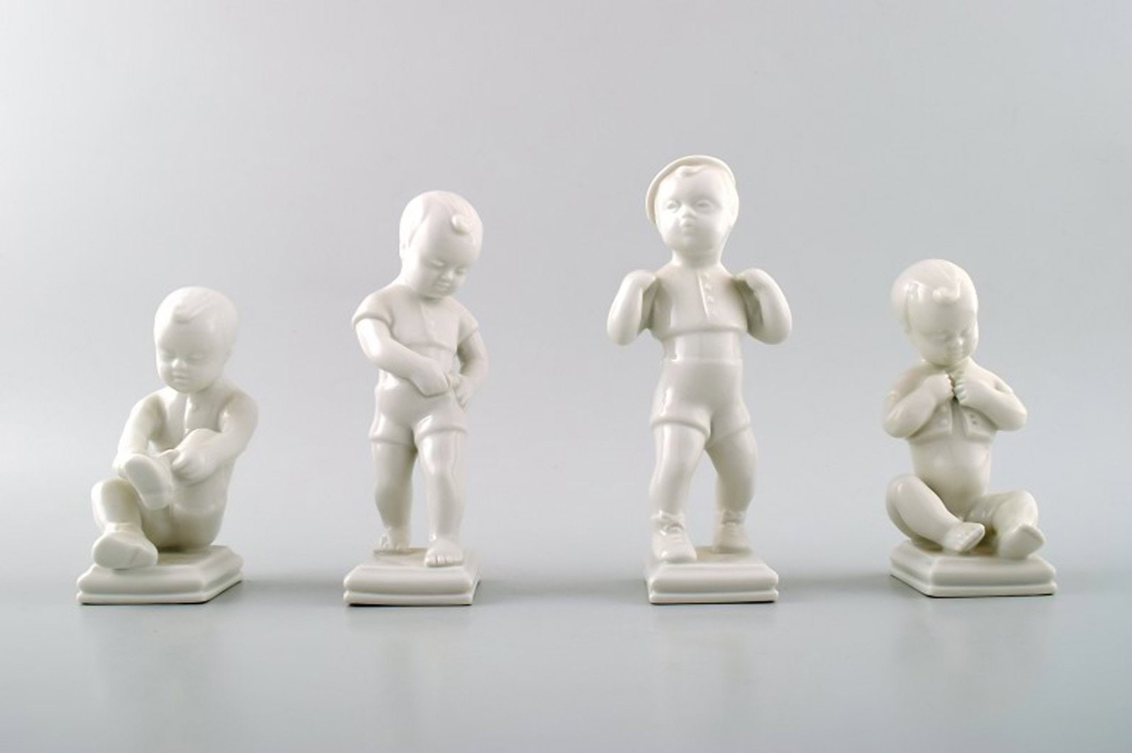 Edit Bjurström (1912-1998) for Rörstrand, Sweden. 4 boy figures in blanc de chine/white: Brand: Rörstrand Edit Bjurström (1912-1998) for Rörstrand, Sweden. 4 boy figures in blanc de chine/white porcelain. Reserve: $238.00 Shipping: Domestic: Shipping rates are determined