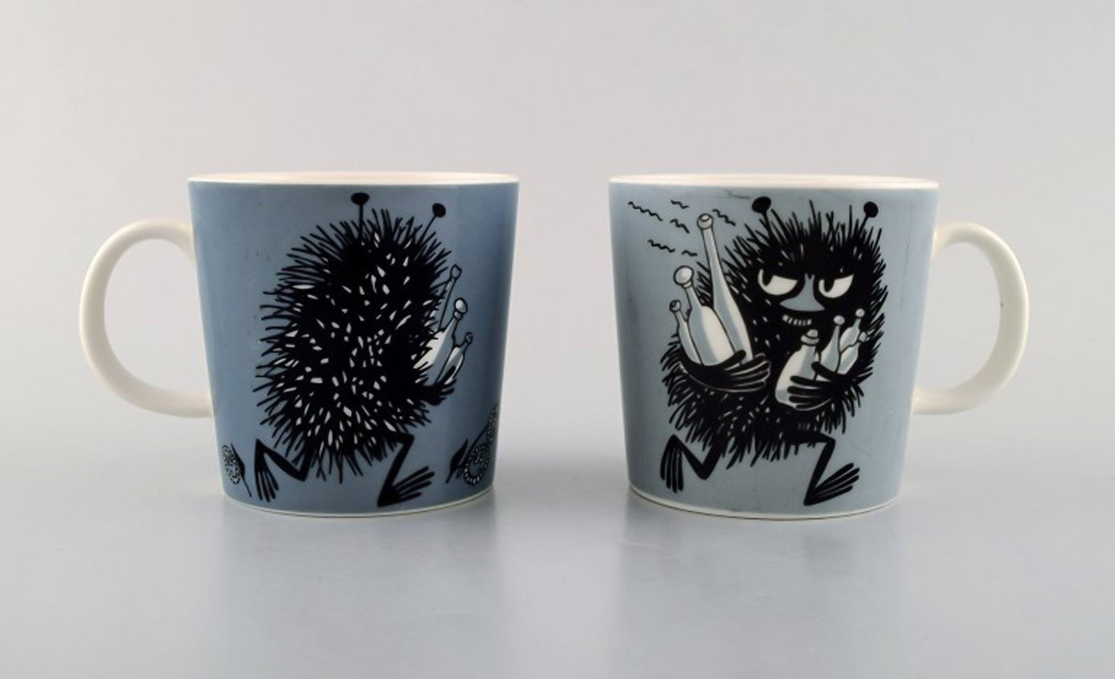Arabia, Finland. Two cups in porcelain with motifs from "Moomin". Late 20th century.: Brand: Arabia Arabia, Finland. Two cups in porcelain with motifs from "Moomin". Late 20th century. Reserve: $189.00 Shipping: Domestic: Shipping rates are determined by destination International:
