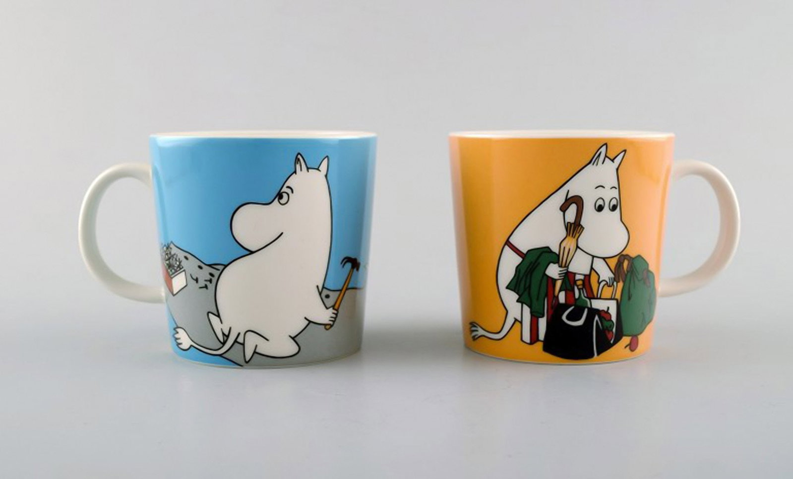 Arabia, Finland. Two cups in porcelain with motifs from "Moomin". Late 20th century.: Brand: Arabia Arabia, Finland. Two cups in porcelain with motifs from "Moomin". Late 20th century. Reserve: $189.00 Shipping: Domestic: Shipping rates are determined by destination International: