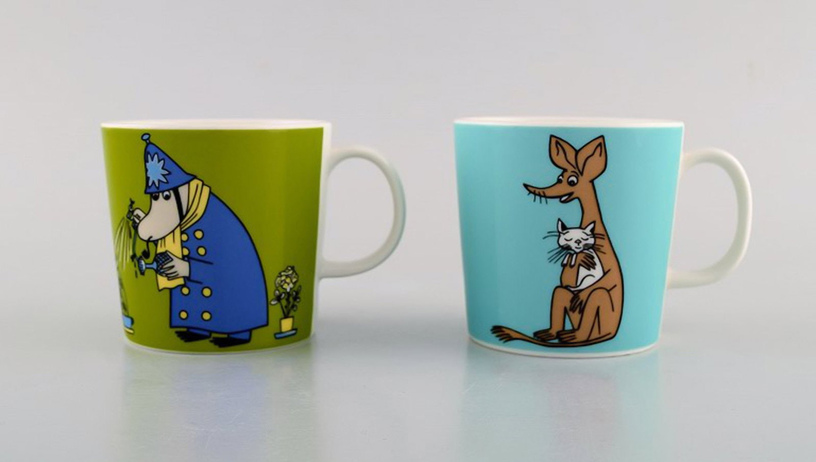 Arabia, Finland. Two cups in porcelain with motifs from "Moomin". Late 20th century.: Brand: Arabia Arabia, Finland. Two cups in porcelain with motifs from "Moomin". Late 20th century. Reserve: $189.00 Shipping: Domestic: Shipping rates are determined by destination International: