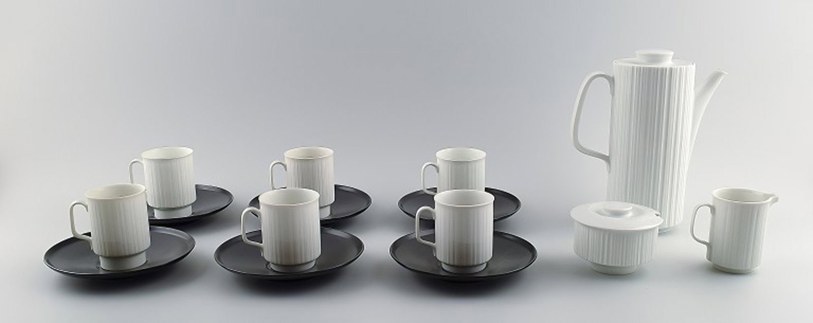 Tapio Wirkkala for Rosenthal Studio-line Porcelaine noire, 6 person mocha service in black and white: Brand: Rosenthal Tapio Wirkkala for Rosenthal Studio-line Porcelaine noire, 6 person mocha service in black and white porcelain, modern design, fluted. Designed in 1962. Reserve: $490.00 Shipping: Dom