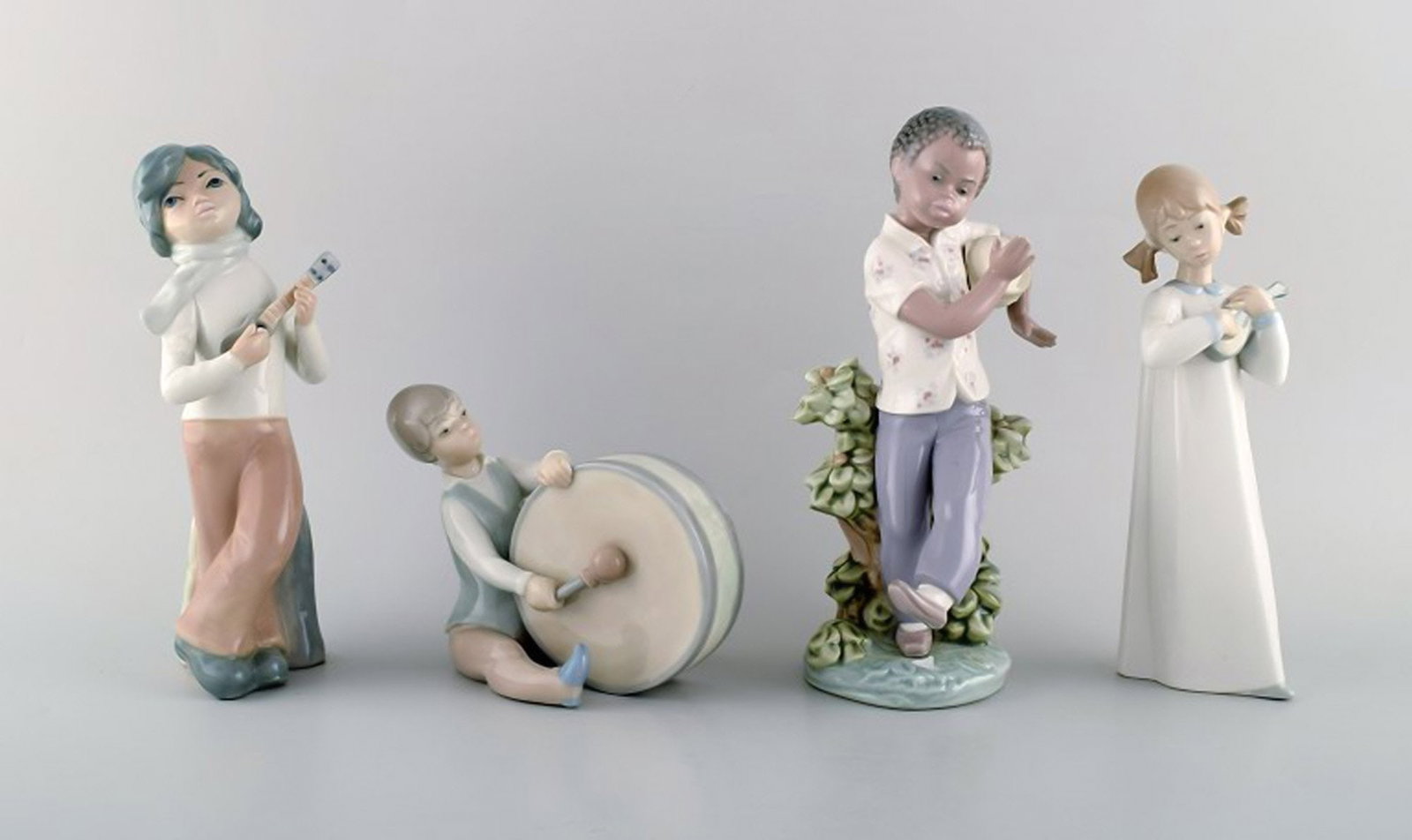 Lladro, Spain. Four porcelain figurines. Children with instruments. 1980's.: Brand: Lladro Lladro, Spain. Four porcelain figurines. Children with instruments. 1980's. Reserve: $259.00 Shipping: Domestic: Shipping rates are determined by destination International: Foreign