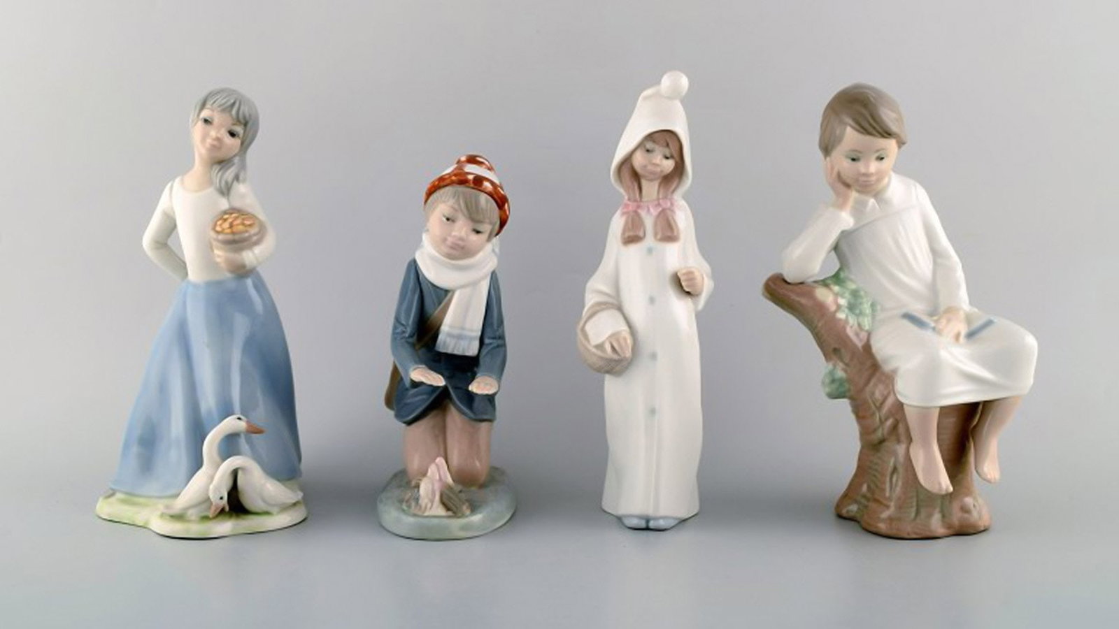 Lladro, Tengra and Zaphir, Spain. Four porcelain figurines of children. 1980 / 90's.: Brand: Lladro Lladro, Tengra and Zaphir, Spain. Four porcelain figurines of children. 1980 / 90's. Reserve: $210.00 Shipping: Domestic: Shipping rates are determined by destination International: