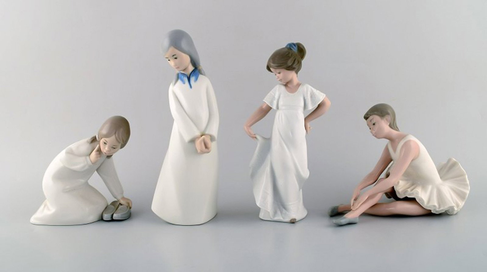 Lladro, Nao and Rex, Spain. Four porcelain figurines of young girls. 1970/80's.: Brand: Lladro Lladro, Nao and Rex, Spain. Four porcelain figurines of young girls. 1970/80's. Reserve: $210.00 Shipping: Domestic: Shipping rates are determined by destination International: Foreign s