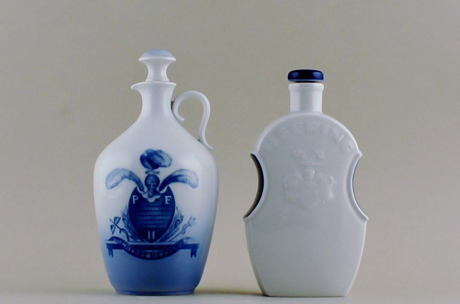 2 B&G (Bing & Grondahl) and Royal Copenhagen "Heering" liquor jugs with stopper.: Brand: Bing & Grøndahl 2 B&G (Bing & Grondahl) and Royal Copenhagen "Heering" liquor jugs with stopper. Reserve: $95.00 Shipping: Domestic: Shipping rates are determined by destination