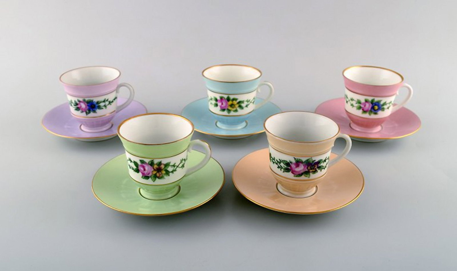 Five early Bing and Grondahl coffee cups with saucers. Hand-painted flower decoration and overglaze.: Brand: Bing & Grøndahl Five early Bing and Grondahl coffee cups with saucers. Hand-painted flower decoration and overglaze. Ca. 1920. Reserve: $238.00 Shipping: Domestic: Shipping rates are