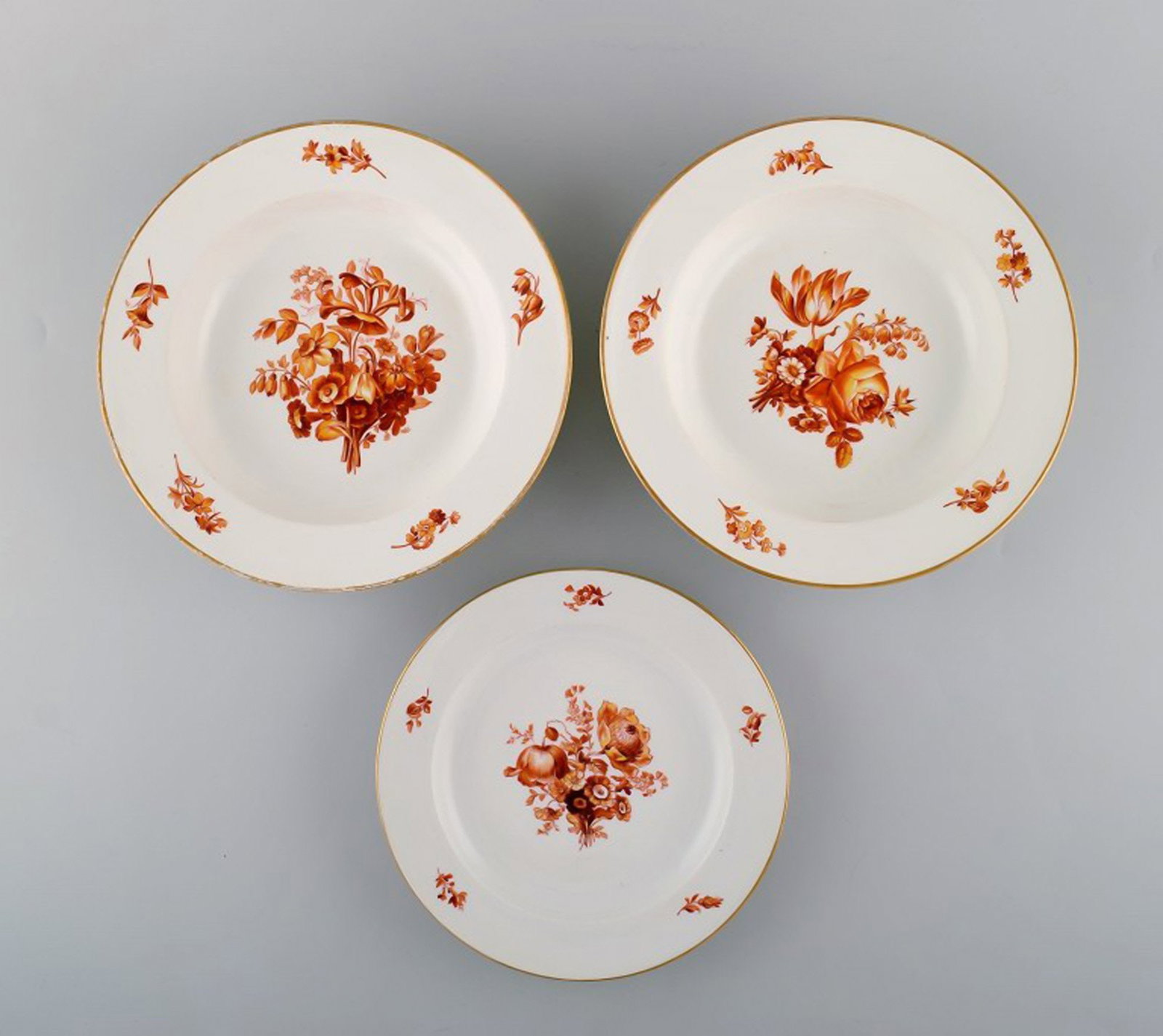 Three antique Meissen porcelain plates with orange hand-painted flowers. Two deep plates and one: Brand: Meissen Three antique Meissen porcelain plates with orange hand-painted flowers. Two deep plates and one lunch plate. 19th century. Reserve: $588.00 Shipping: Domestic: Shipping rates are