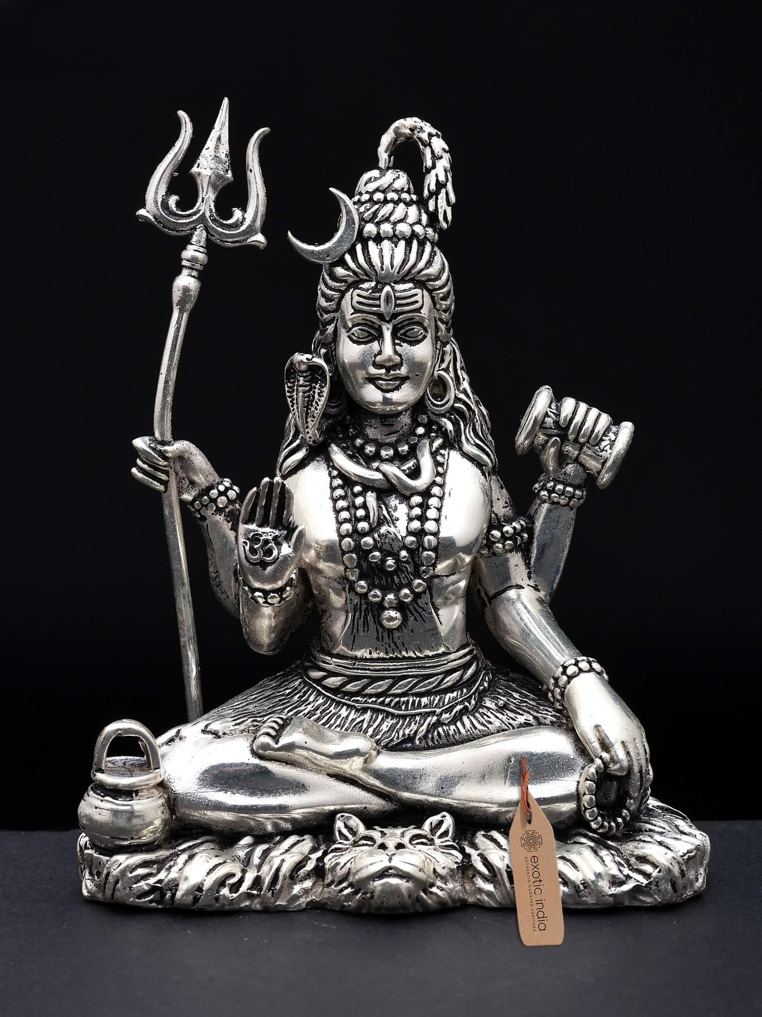 Superfine Idol of Bhole Shankara Small Brass Statue: Title: Superfine Idol of Bhole Shankara Small Brass Statue Description: Shiva, the Auspicious One, transcends mortal essence as the Supreme Lord, weaving cosmic tapestries with creation, protection, a