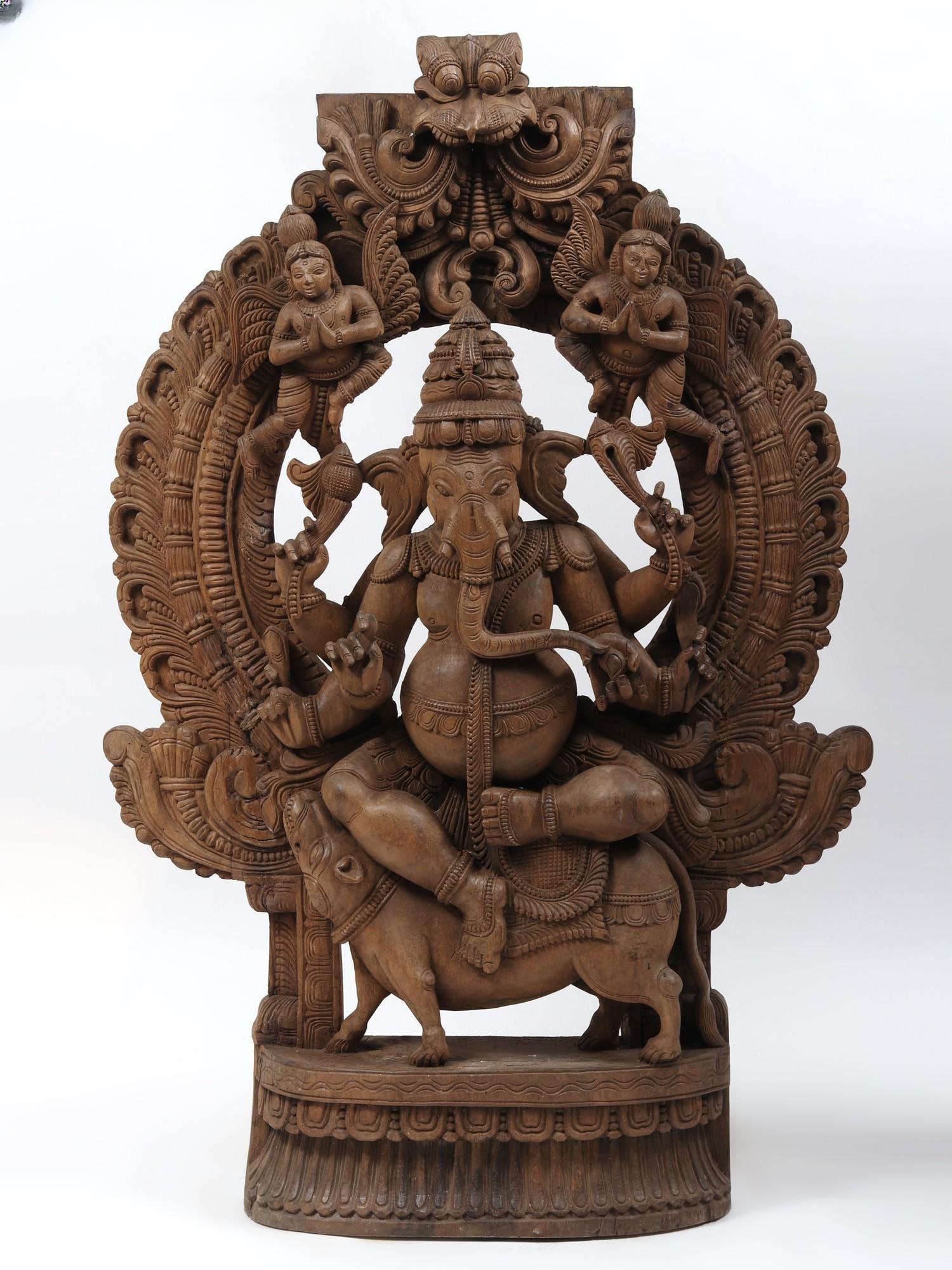 48" Lord Ganesha Seated on Rat with Kirtimukha Throne | Wood Carved Statue: Title: 48" Lord Ganesha Seated on Rat with Kirtimukha Throne | Wood Carved Statue Description: Additional Information: Hindu Gods & Goddesses Statues Reserve: $1,754.00 Shipping: Domestic: Flat-rate o