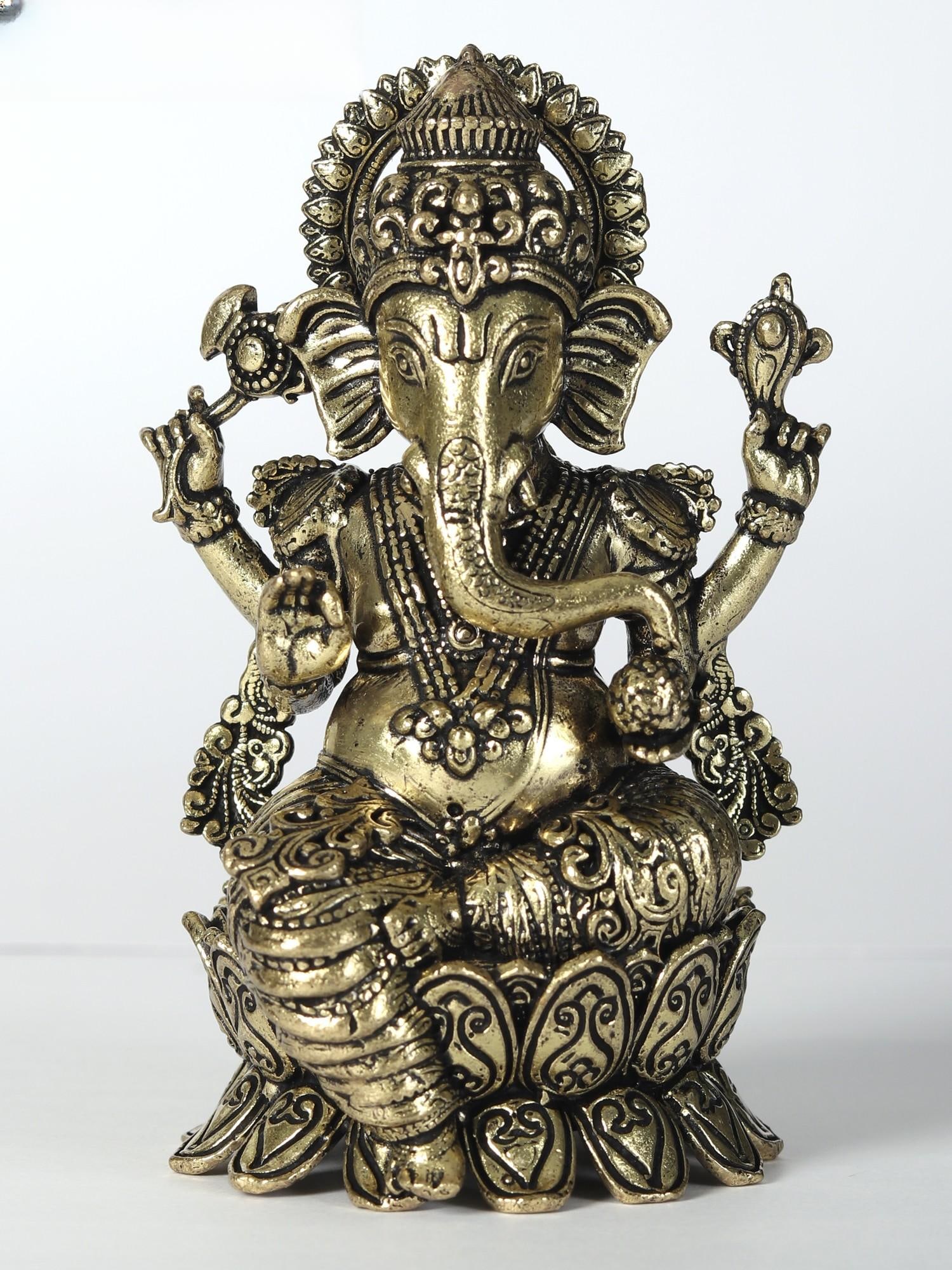 3" Attractive Superfine Lord Ganesha Statue: Title: 3" Attractive Superfine Lord Ganesha Statue Description: Seated gracefully upon a lotus, Lord Ganesha, the bestower of eternal bliss, emerges as the epitome of divine splendour. Cloaked in rega