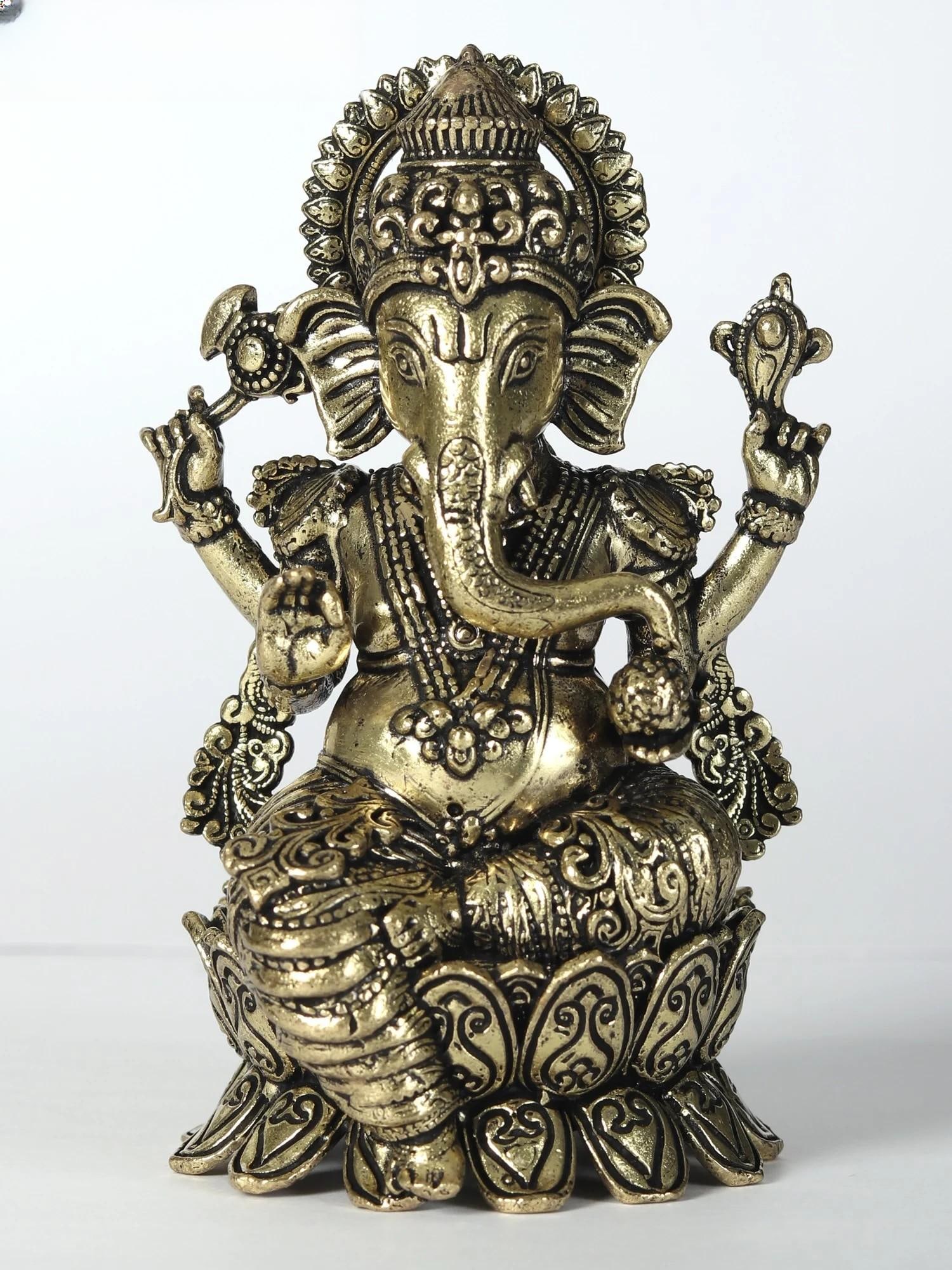 3" Attractive Superfine Lord Ganesha Statue: Title: 3" Attractive Superfine Lord Ganesha Statue Description: Seated gracefully upon a lotus, Lord Ganesha, the bestower of eternal bliss, emerges as the epitome of divine splendour. Cloaked in rega