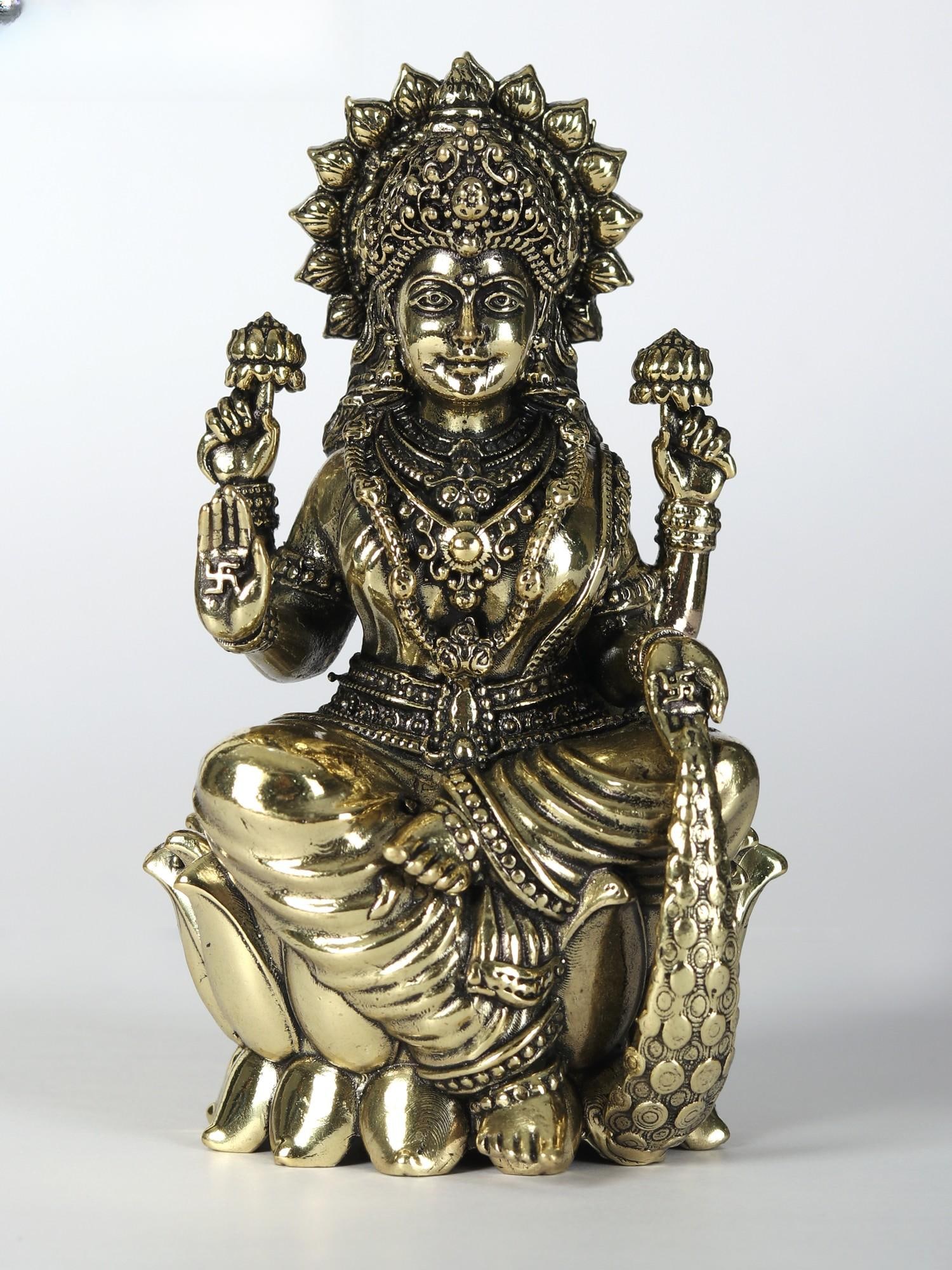 Small Brass Statue of Superfine Goddess Lakshmi Seated on Lotus | Multiple Sizes: Title: Small Brass Statue of Superfine Goddess Lakshmi Seated on Lotus | Multiple Sizes Description: The form of goddess Lakshmi, represented in this superfine brass statue with grace atop an open lot