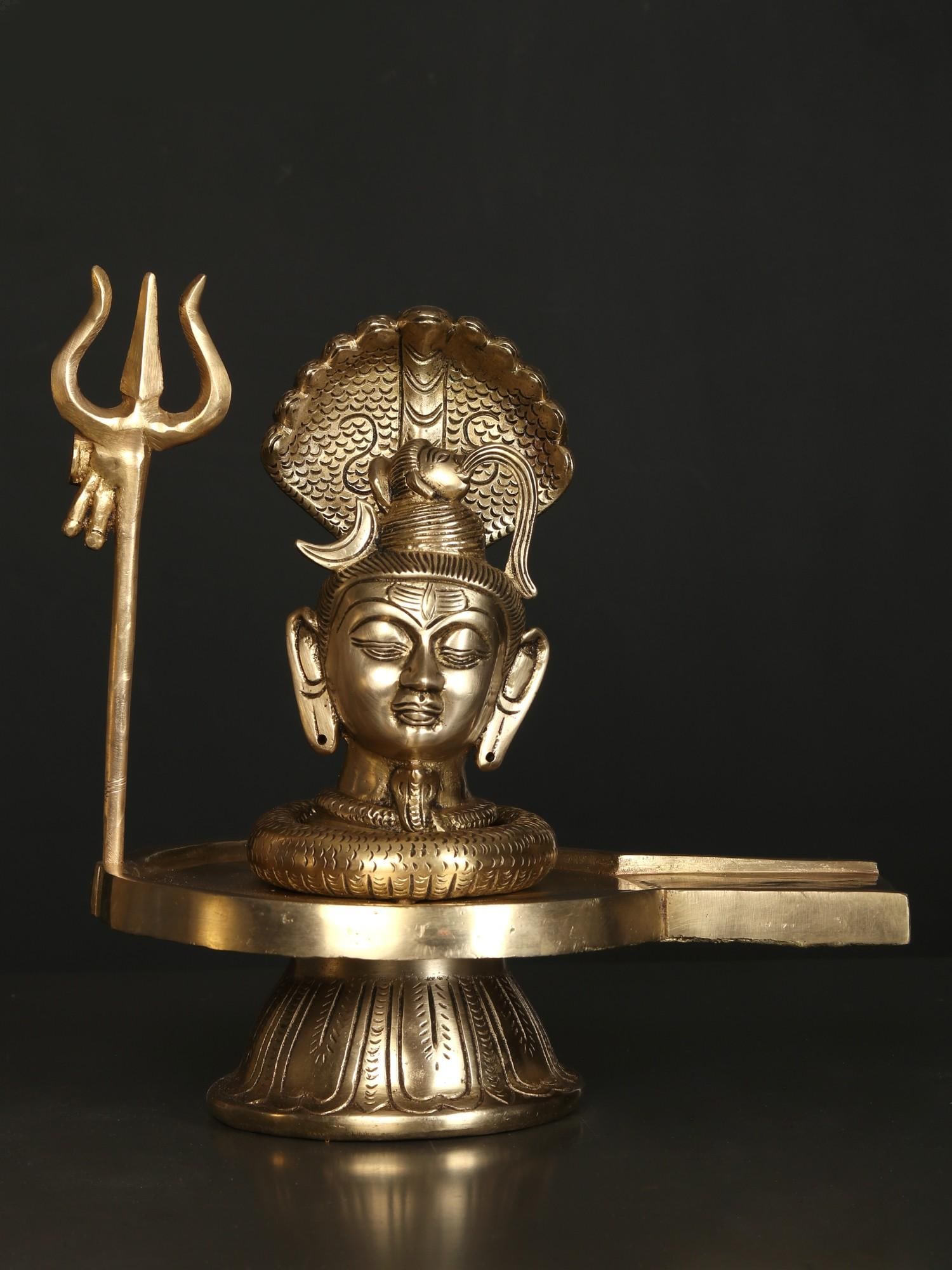 11" Brass Shiva Head Shivalinga with Vasuki Naag and Trident: Title: 11" Brass Shiva Head Shivalinga with Vasuki Naag and Trident Description: Additional Information: Hindu Gods & Goddesses Statues Reserve: $347.00 Shipping: Domestic: Flat-rate of $39.00 to anyw