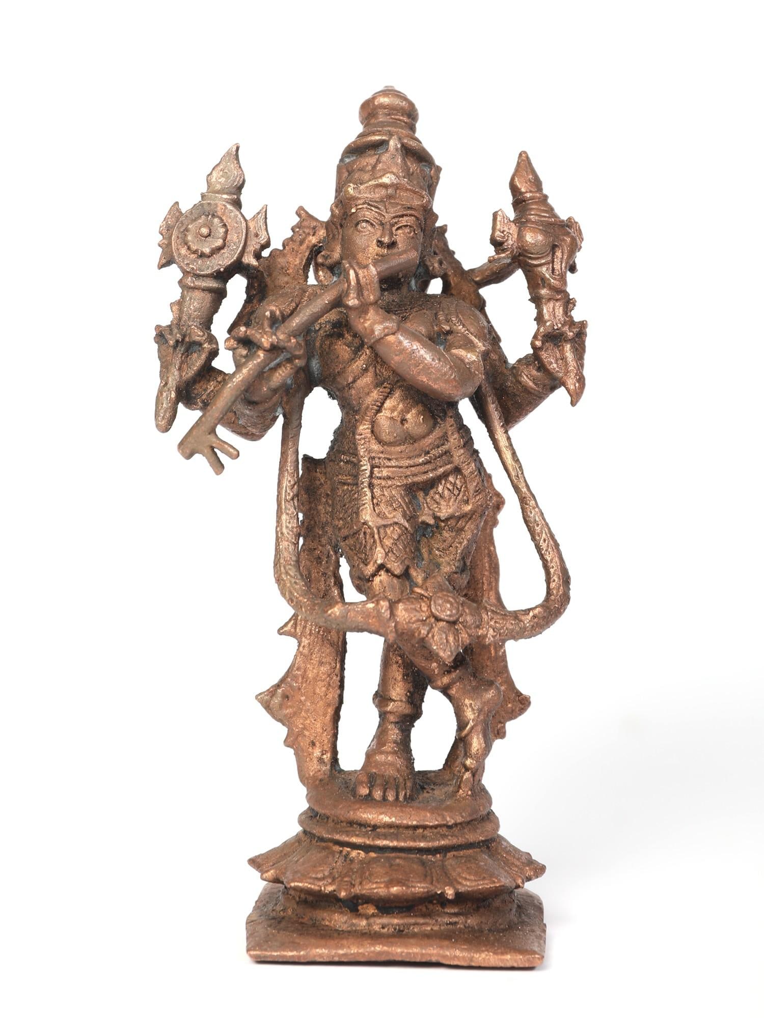 5" Small Venugopal Krishna Copper Statue: Title: 5" Small Venugopal Krishna Copper Statue Description: This painstakingly crafted Venugopala sculpture pays homage to Lord Krishna's celestial avatar, Venugopal, the revered flute-playing deity 