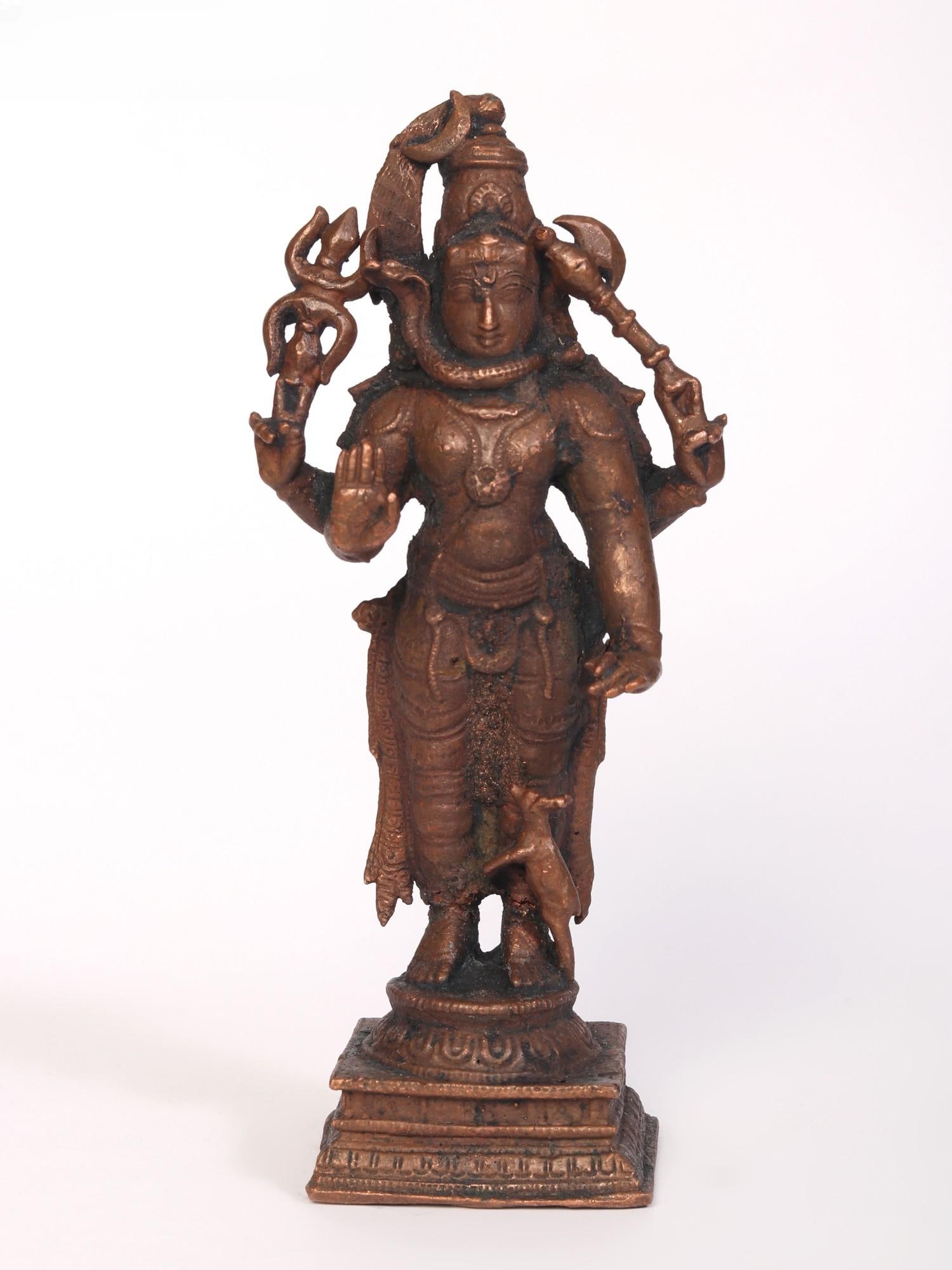 6" Small Standing Lord Shiva Copper Statue: Title: 6" Small Standing Lord Shiva Copper Statue Description: Lord Shiva is the Mahadev or the supreme god. He has the power to destroy, thus initiating the process of creation. This Small Standing