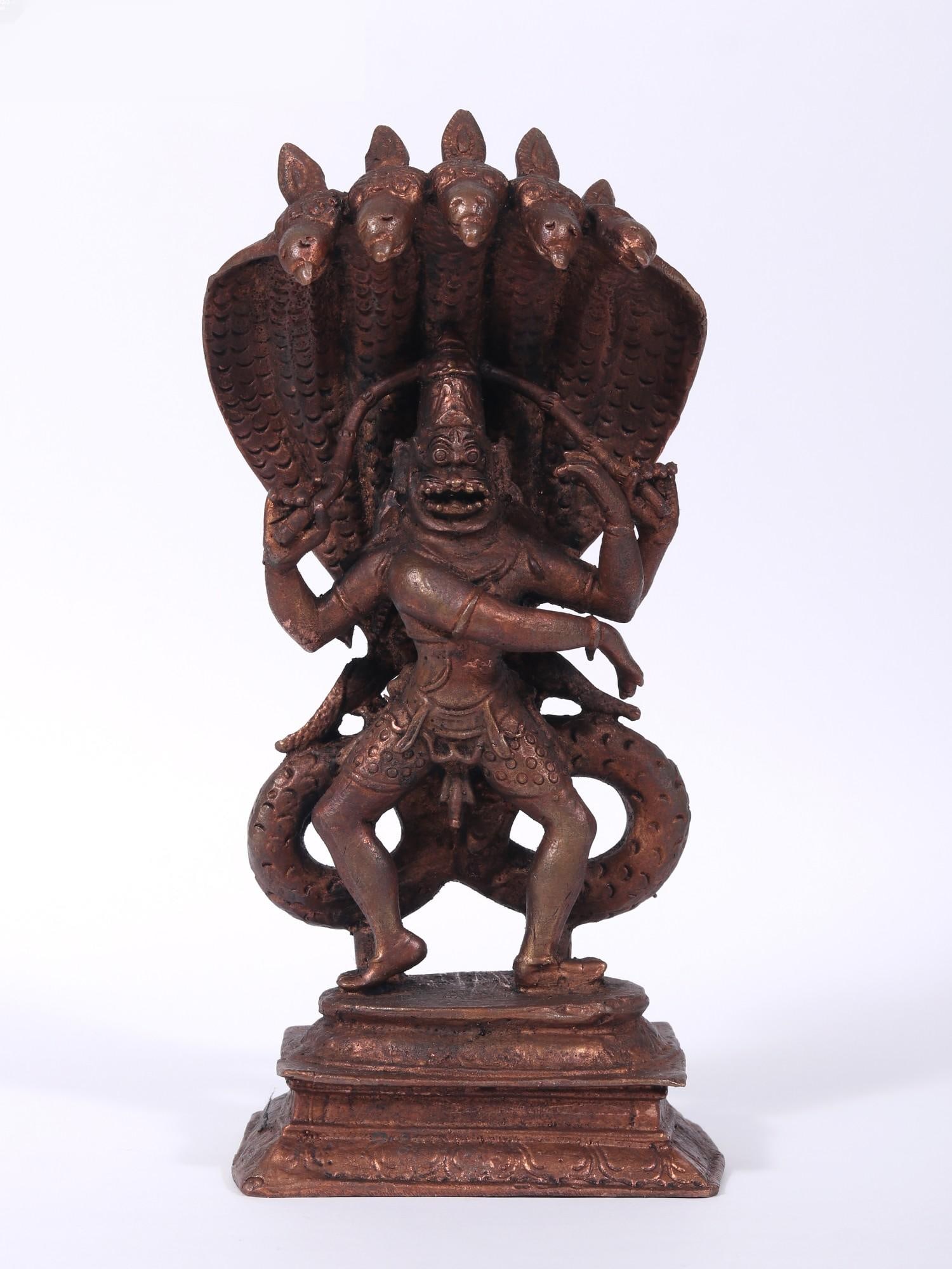 7" Chaturbhuj Lord Narasimha Copper Statue: Title: 7" Chaturbhuj Lord Narasimha Copper Statue Description: The depiction of Lord Narasimha, the Fourth Incarnation of Lord Vishnu, in this portrayal is awe-inspiring. Capturing the essence of his 