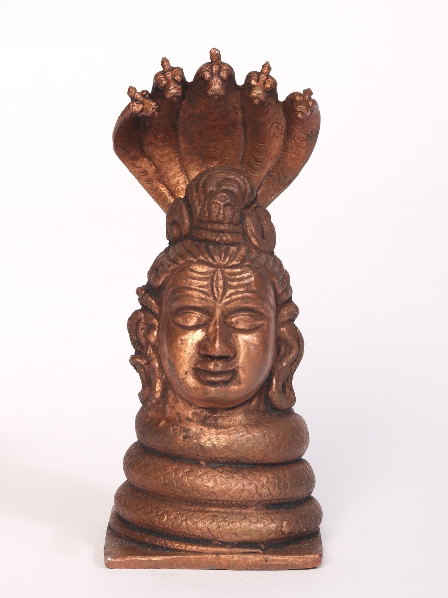 5" Small Lord Shiva Head Copper Statue: Title: 5" Small Lord Shiva Head Copper Statue Description: Lord Shiva is the Adi Yogi and the destroyer of darkness. He is worshipped by many to ask for his blessings that can guide individuals on the