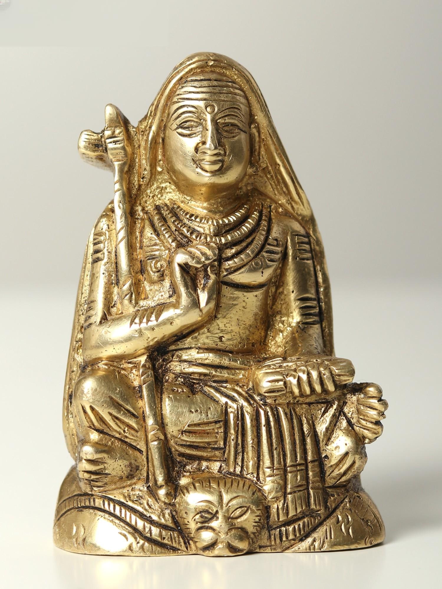 3" Small Adi Guru Shankaracharya Brass Statue: Title: 3" Small Adi Guru Shankaracharya Brass Statue Description: This exquisite brass idol depicts Adi Shankaracharya, the revered 8th-century philosopher and theologian who established Advaita