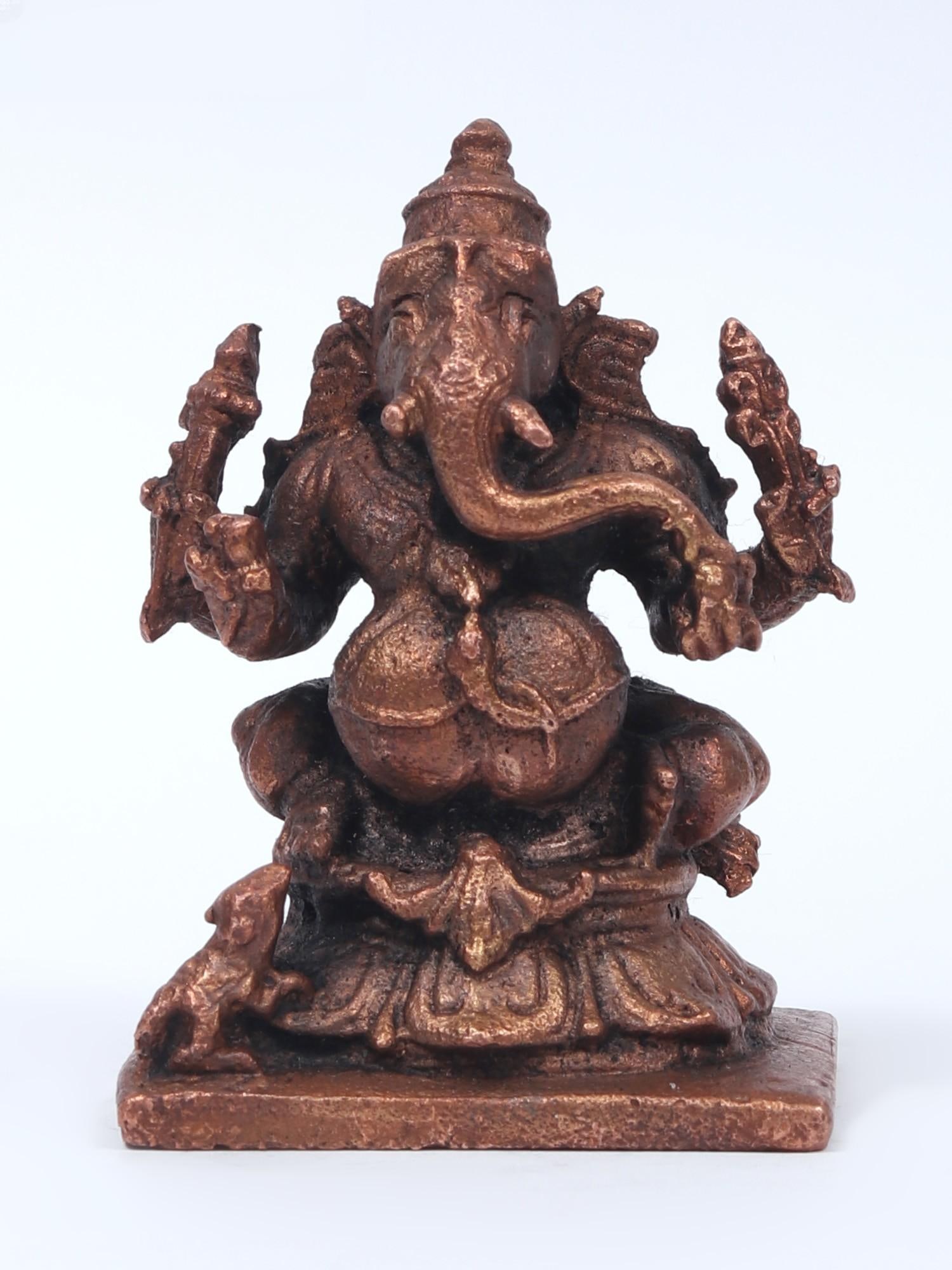 2" Small Four-Armed Lord Ganapati Copper Statue: Title: 2" Small Four-Armed Lord Ganapati Copper Statue Description: This small four-armed Lord Ganapati copper statue is a wonderful depiction of the Lord of Wisdom. It is a poignant observation that