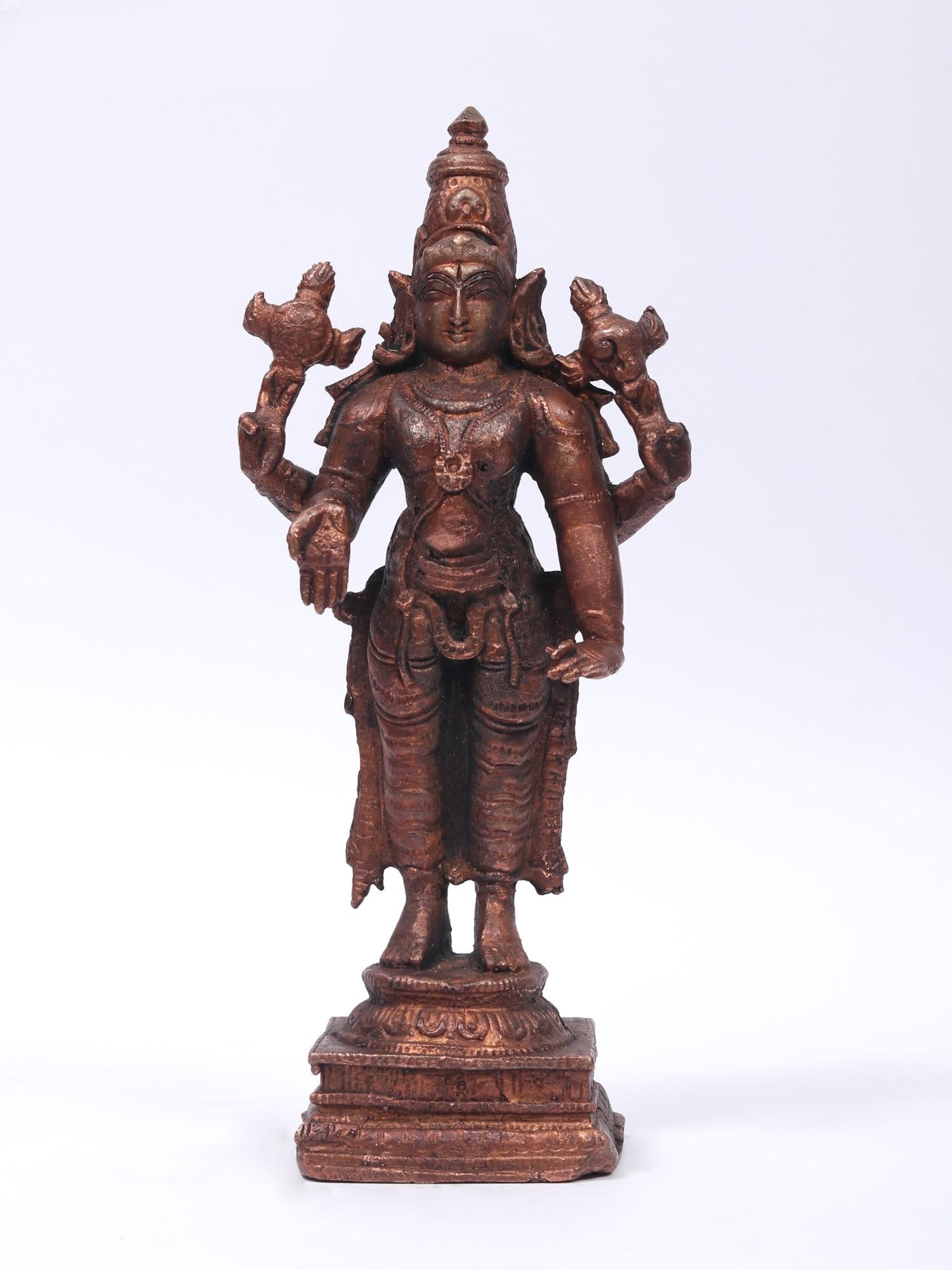 6" Small Four-Armed Standing Lord Vishnu Copper Statue: Title: 6" Small Four-Armed Standing Lord Vishnu Copper Statue Description: This Copper Statue of Lord Vishnu, painted in an ancient copper finish, is an amazing work of art that emits heavenly eleganc