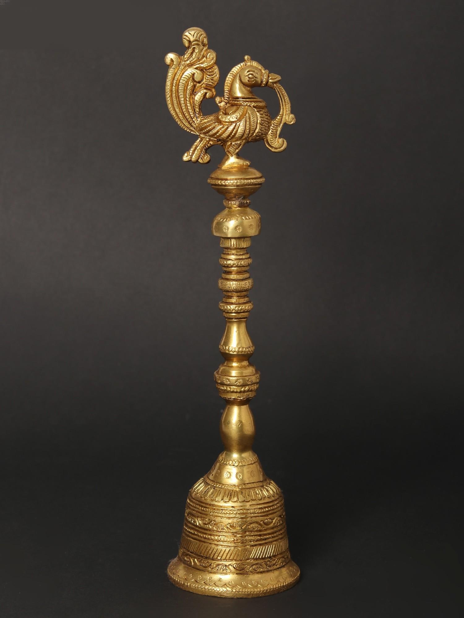 10" Peacock Puja Bell | Ghanti in Brass: Title: 10" Peacock Puja Bell | Ghanti in Brass Description: In Hindu rituals, the ghanti (bell) holds symbolic significance. Its melodious sound is believed to purify the environment and invite