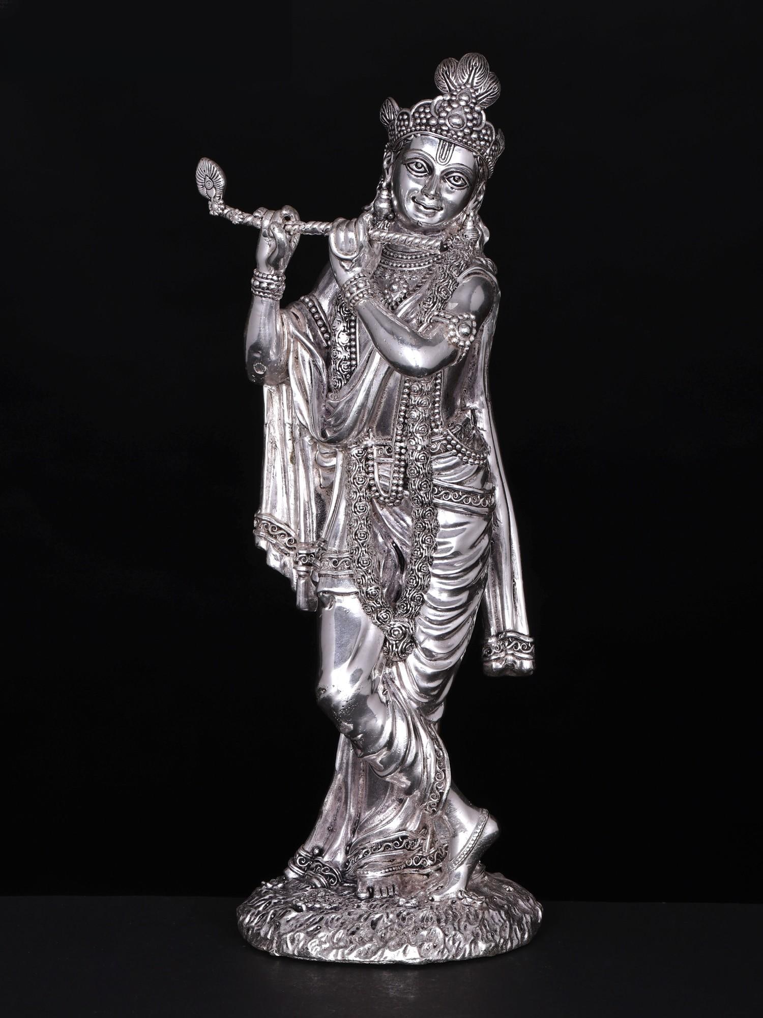 Superfine Standing Lord Krishna Brass Statue Playing Flute: Title: Superfine Standing Lord Krishna Brass Statue Playing Flute Description: The artistic skill of the sculptor is seen in the softness of Krishna’s garment that wraps him beautifully as if
