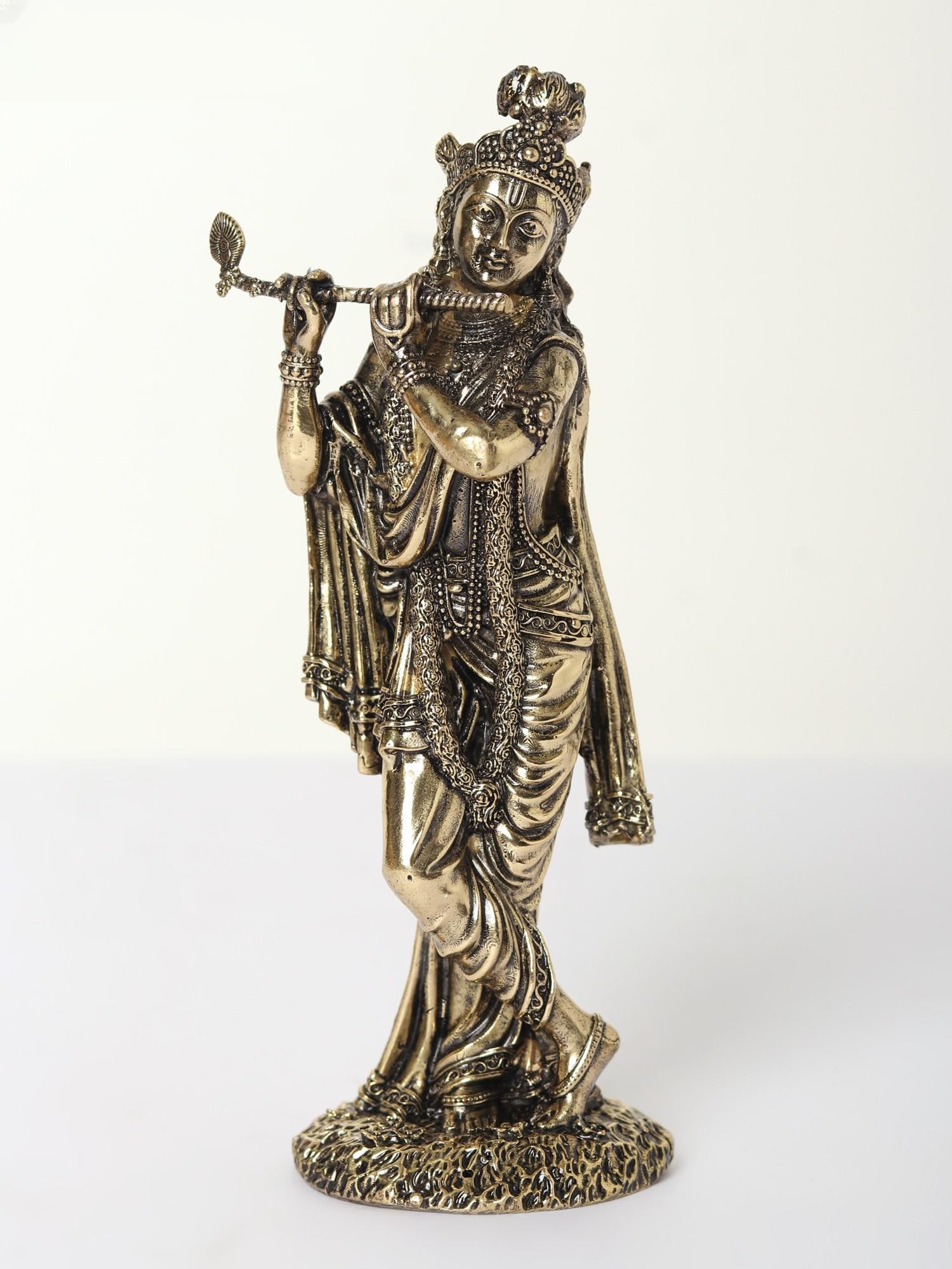 Superfine Standing Lord Krishna Brass Statue Playing Flute: Title: Superfine Standing Lord Krishna Brass Statue Playing Flute Description: The artistic skill of the sculptor is seen in the softness of Krishna’s garment that wraps him beautifully as if Mu