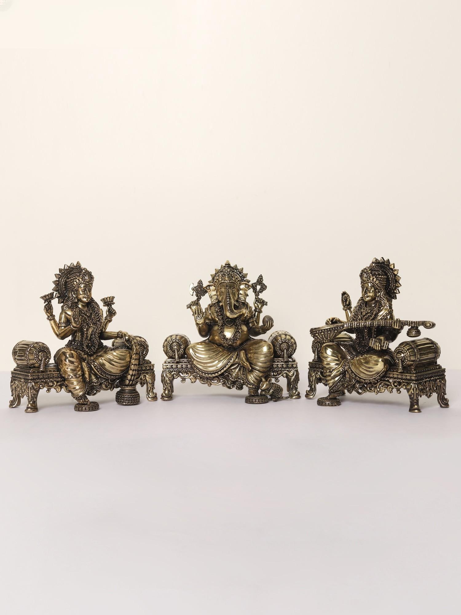 5" Superfine Lakshmi Ganesha Saraswati Idol Seated on Singhasan | Brass Statues: Title: 5" Superfine Lakshmi Ganesha Saraswati Idol Seated on Singhasan | Brass Statues Description: The combined images of Lord Ganesha, Goddess Lakshmi, and Goddess Saraswati hold immense