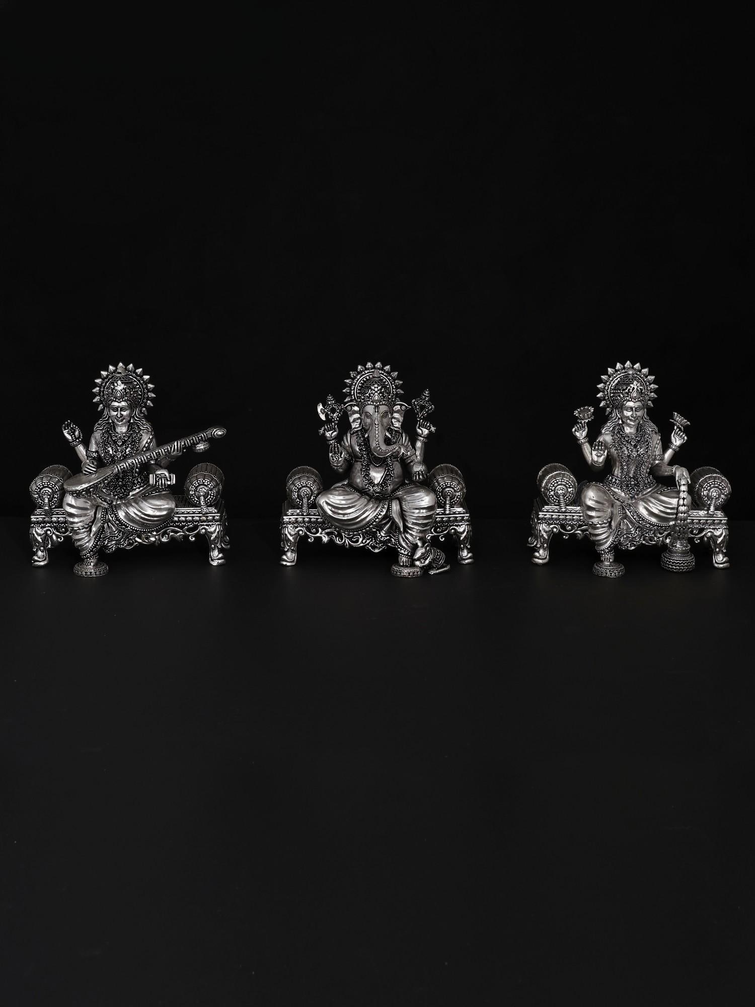 5" Superfine Lakshmi Ganesha Saraswati Idol Seated on Singhasan | Brass Statues: Title: 5" Superfine Lakshmi Ganesha Saraswati Idol Seated on Singhasan | Brass Statues Description: The combined images of Lord Ganesha, Goddess Lakshmi, and Goddess Saraswati hold immense