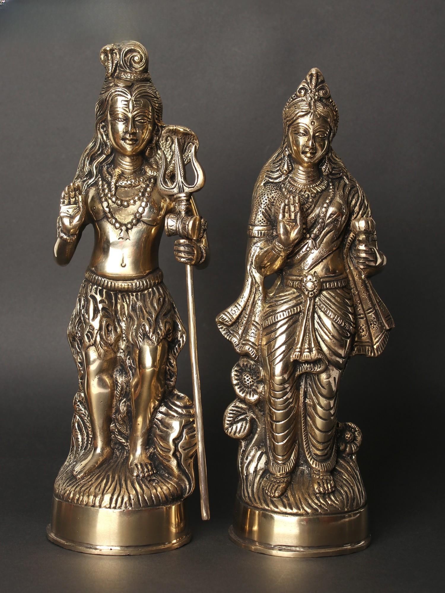 12" Standing Shiva Parvati Idol in Blessing Gesture | Set of Two Brass Statues: Title: 12" Standing Shiva Parvati Idol in Blessing Gesture | Set of Two Brass Statues Description: The image of Lord Shiva and Goddess Parvati standing and blessing their devotees holds spiritual
